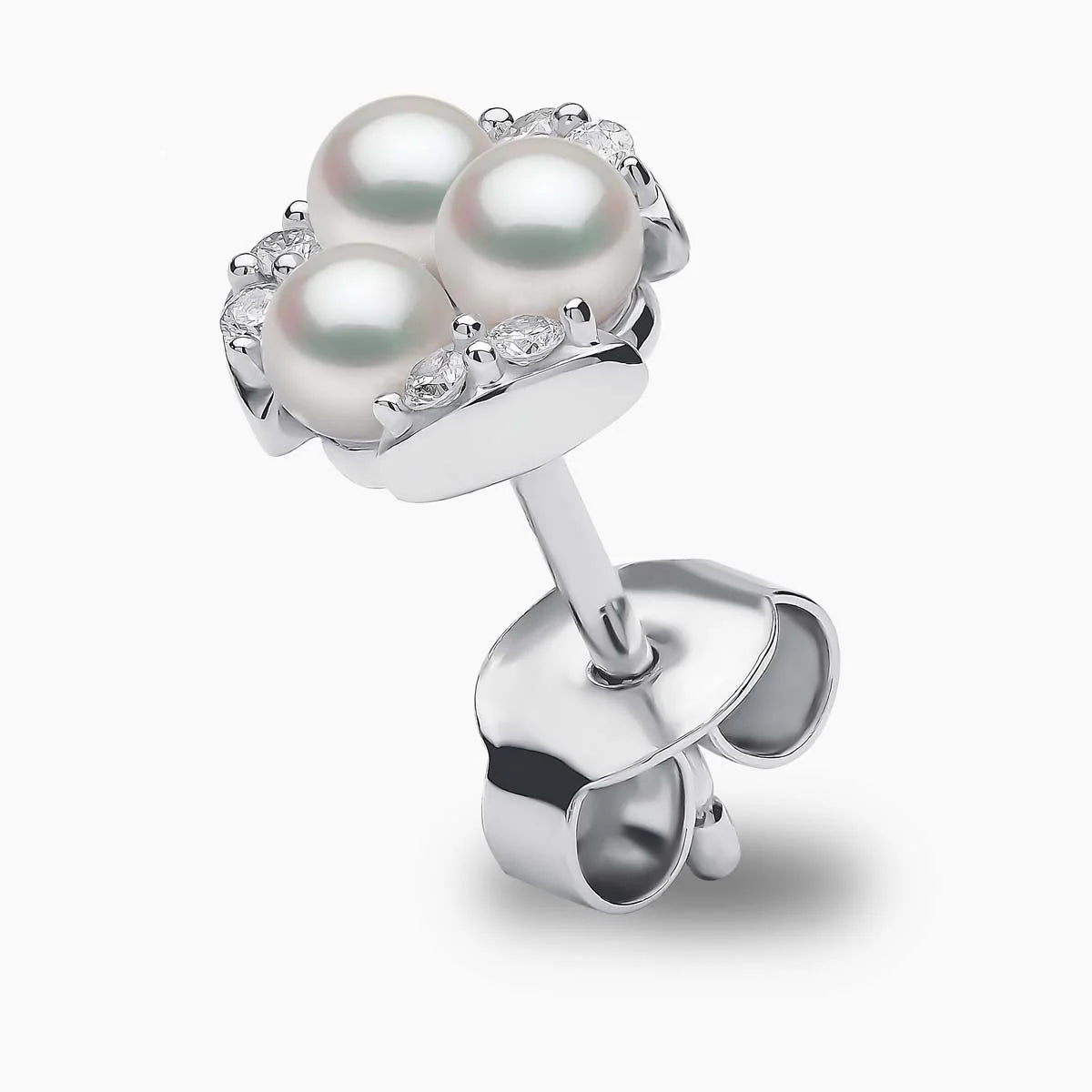White gold triple pearl and diamond stud earring on grey background, standing up view