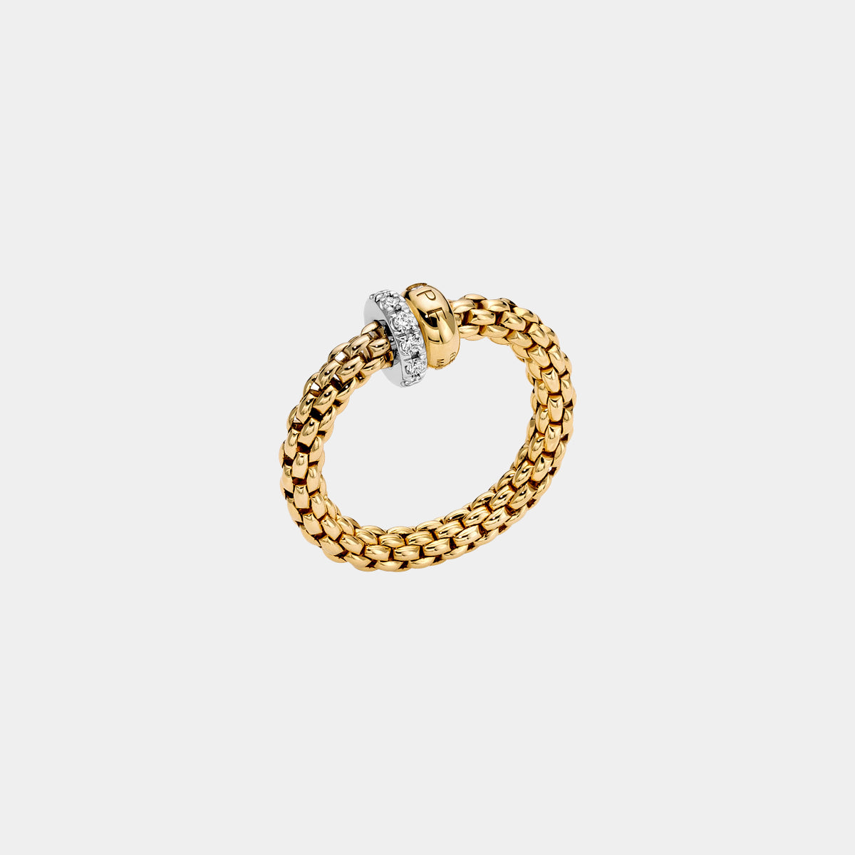 White and yellow gold diamond fashion ring on grey background