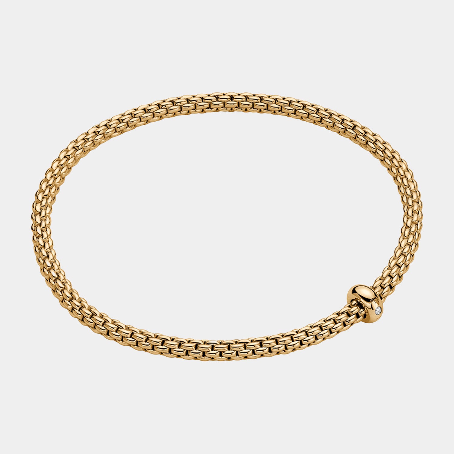 Yellow gold stretch bracelet with diamond charm accent