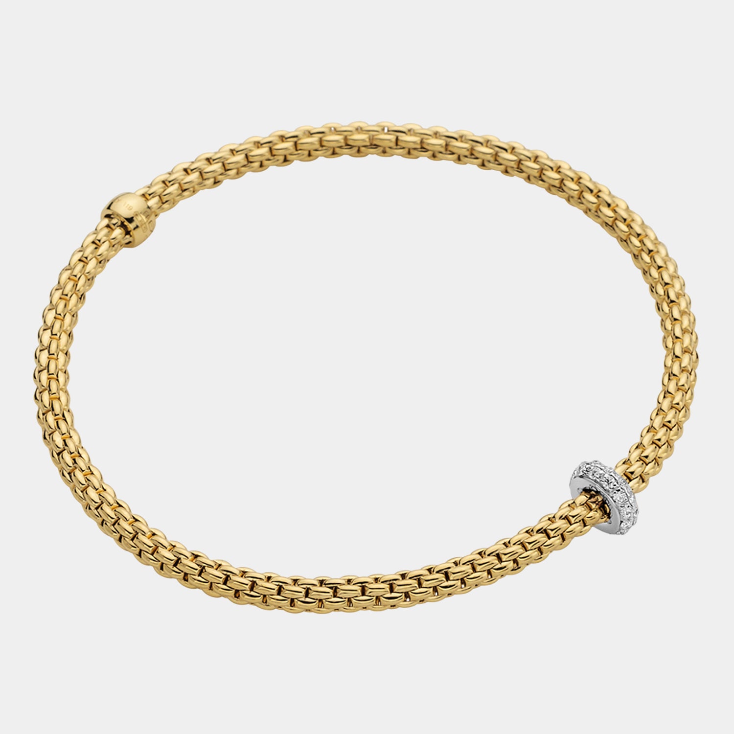 Yellow gold stretch bracelet with white gold diamond charm