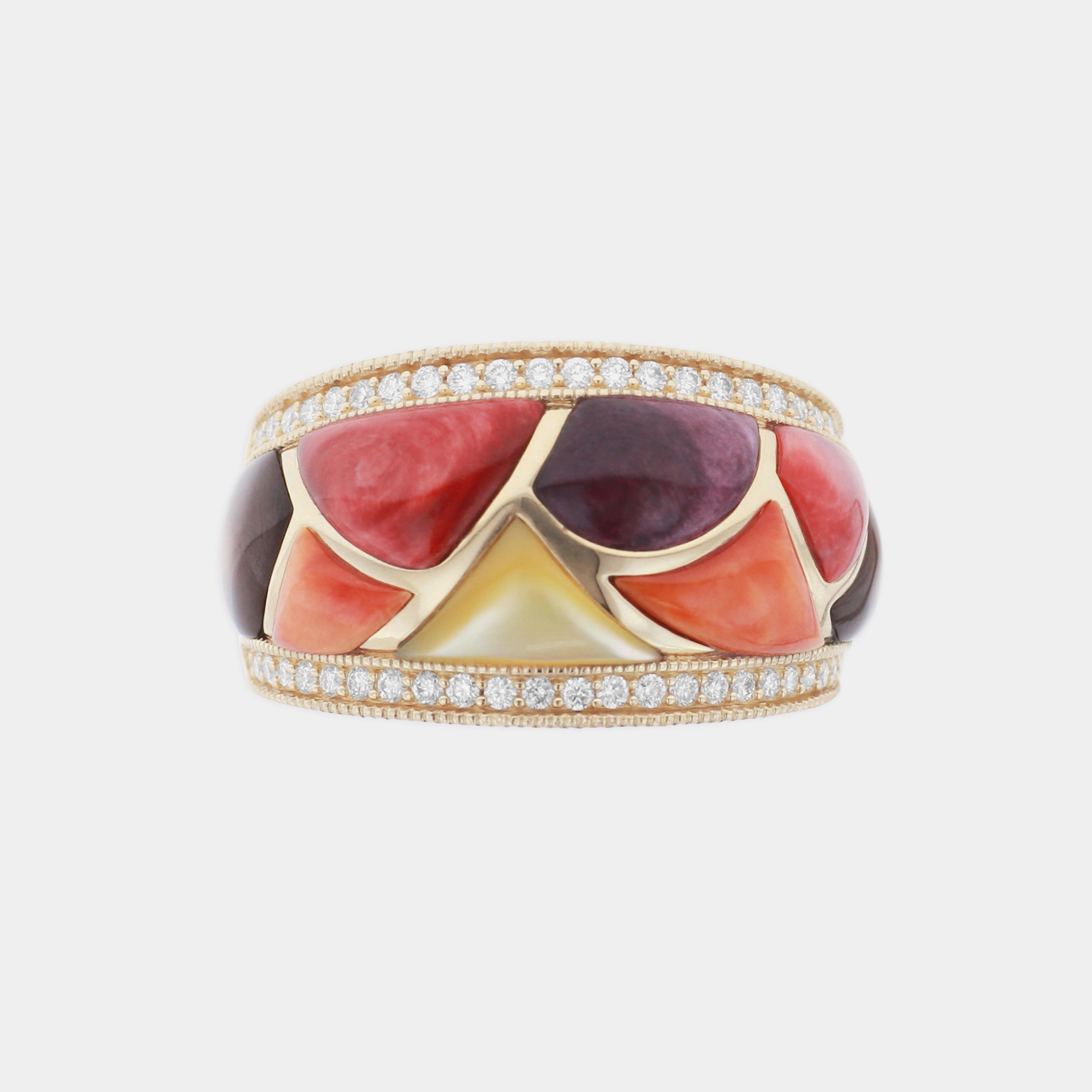 Multi colored mother of pearl and diamond ring on grey background