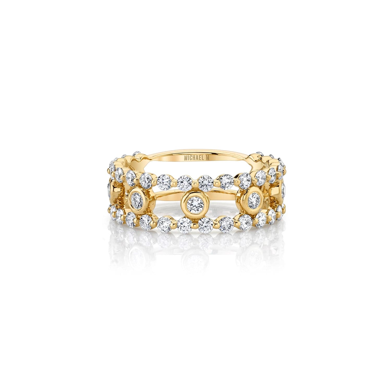 Yellow gold diamond fashion ring on grey background, front view