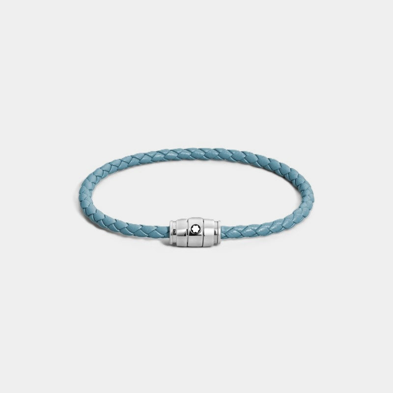 Montblanc smoky blue woven leather bracelet with polished stainless steel three-ring clasp featuring the Montblanc emblem on a grey background, front angle view.