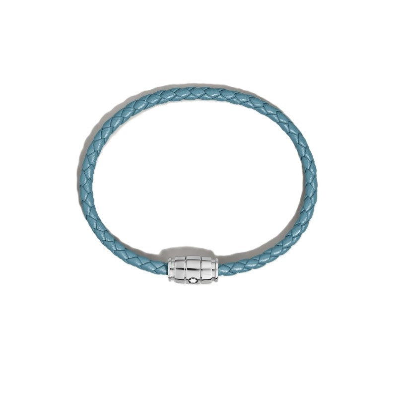 Montblanc smoky blue woven leather bracelet with polished stainless steel three-ring clasp featuring the Montblanc emblem on a grey background, front view.