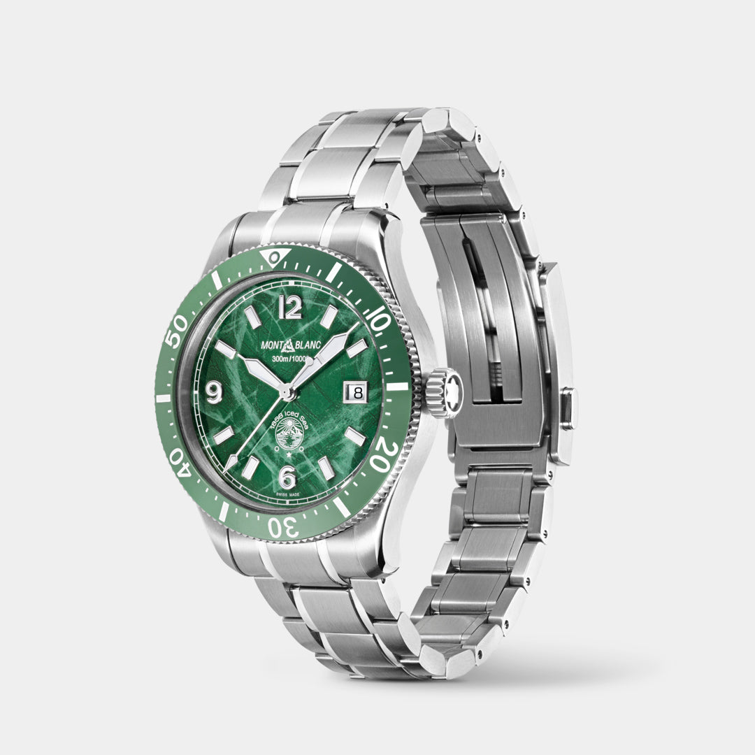 Silver watch with a green dial on a white background