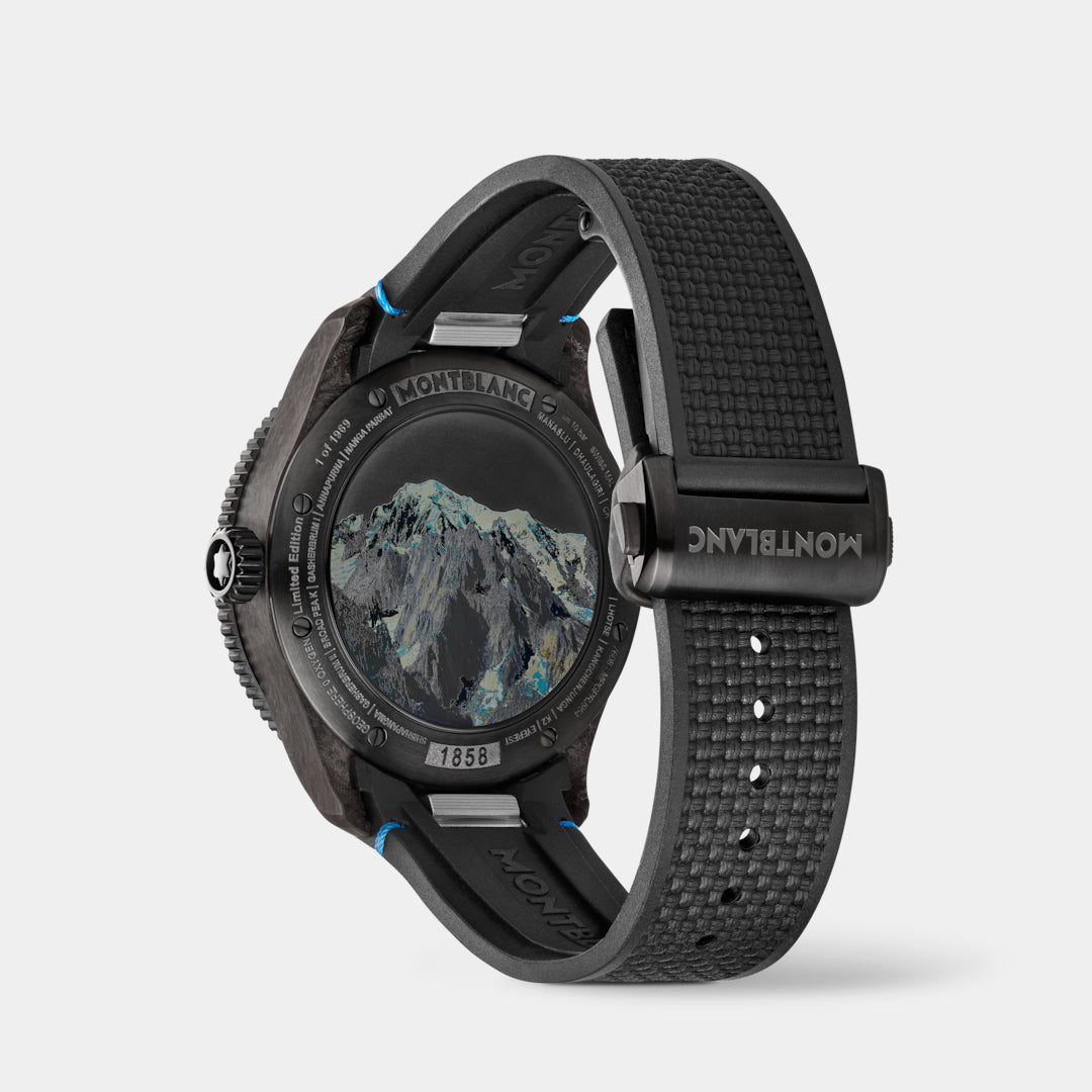 Black watch with mountain design on face and textured strap on light gray background