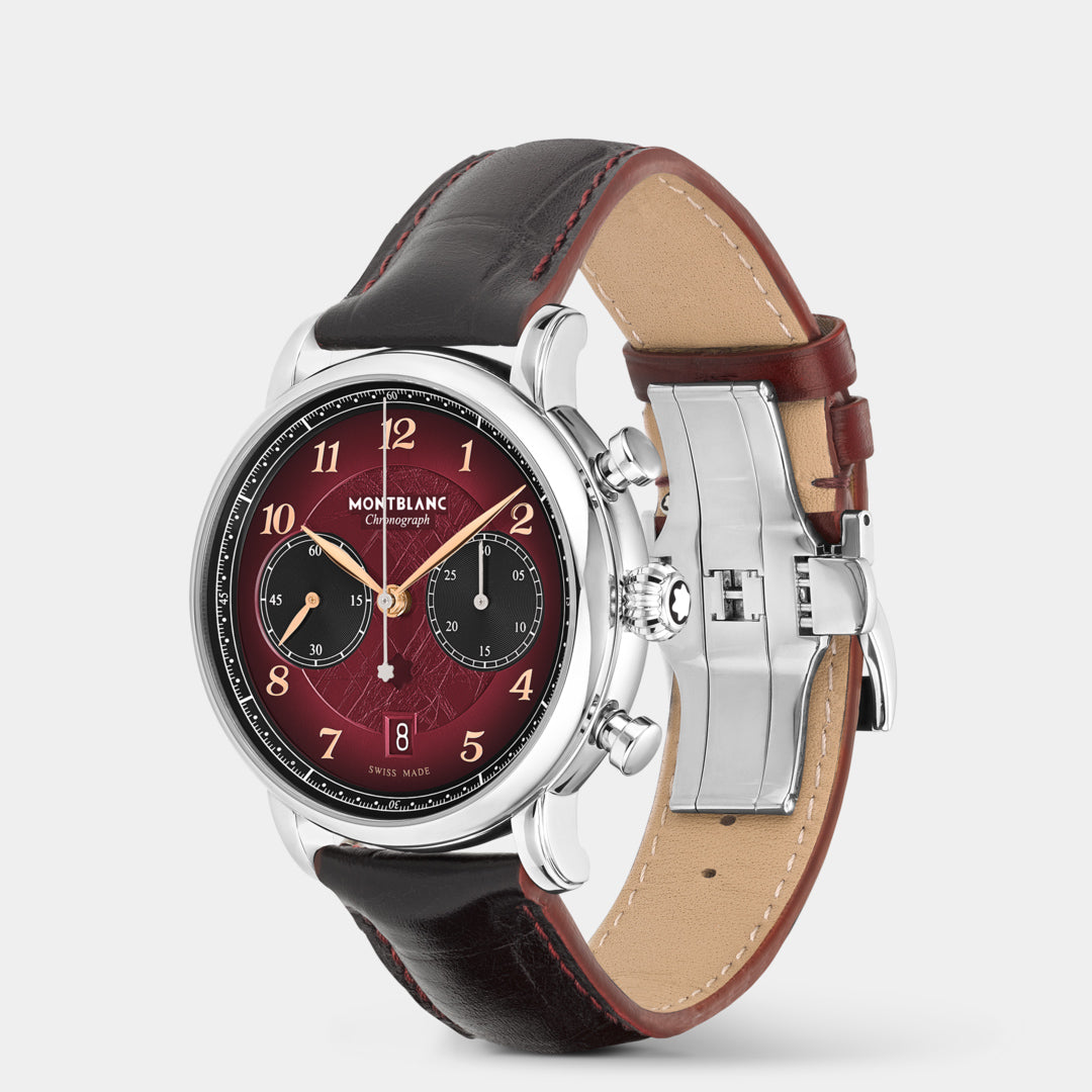 Montblanc watch with a red face and brown leather strap on a light gray background
