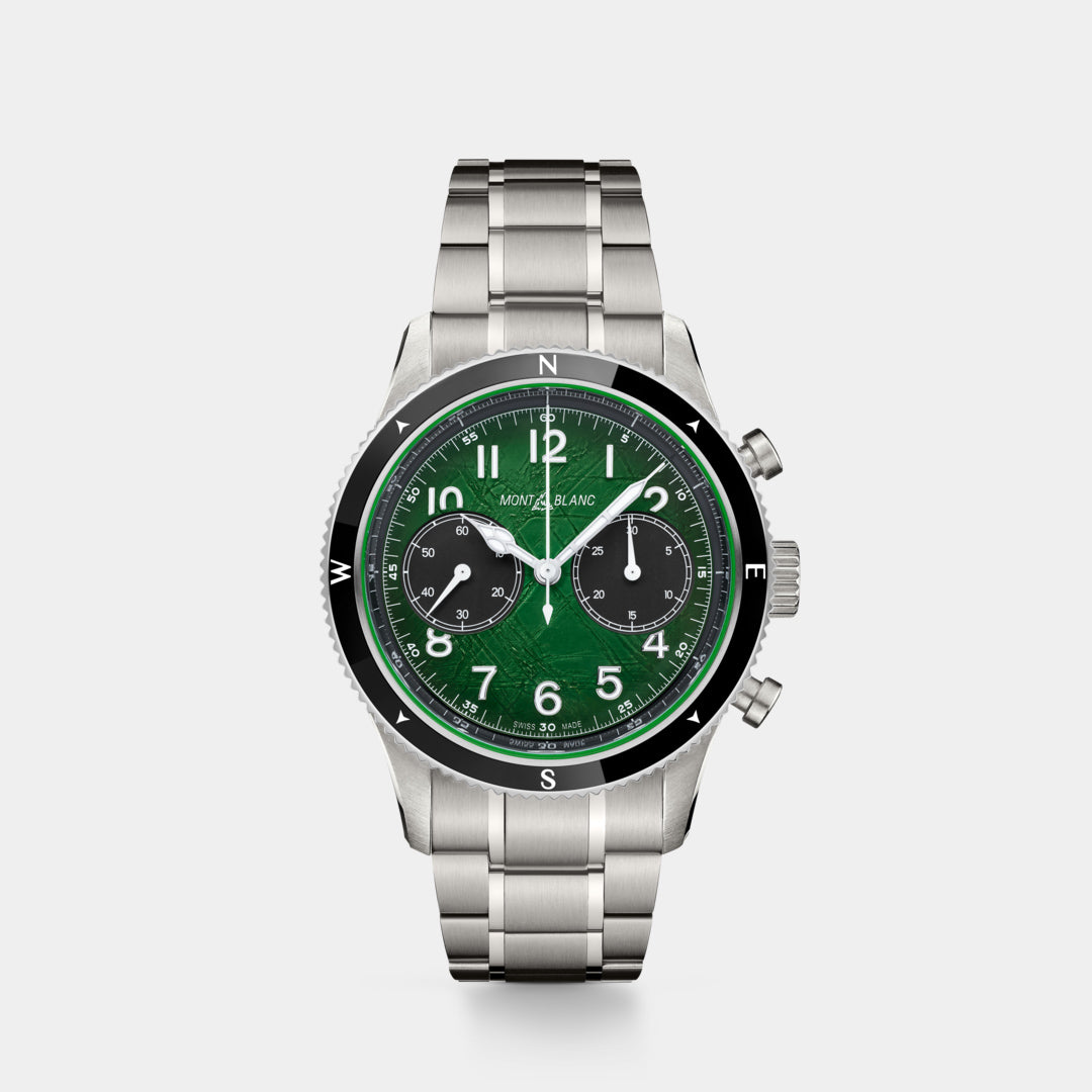 Silver watch with a green face on a white background
