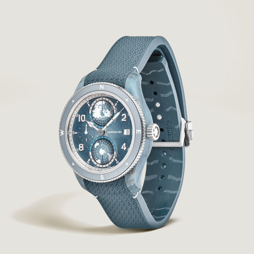 Blue wristwatch with detailed face on a light gray background