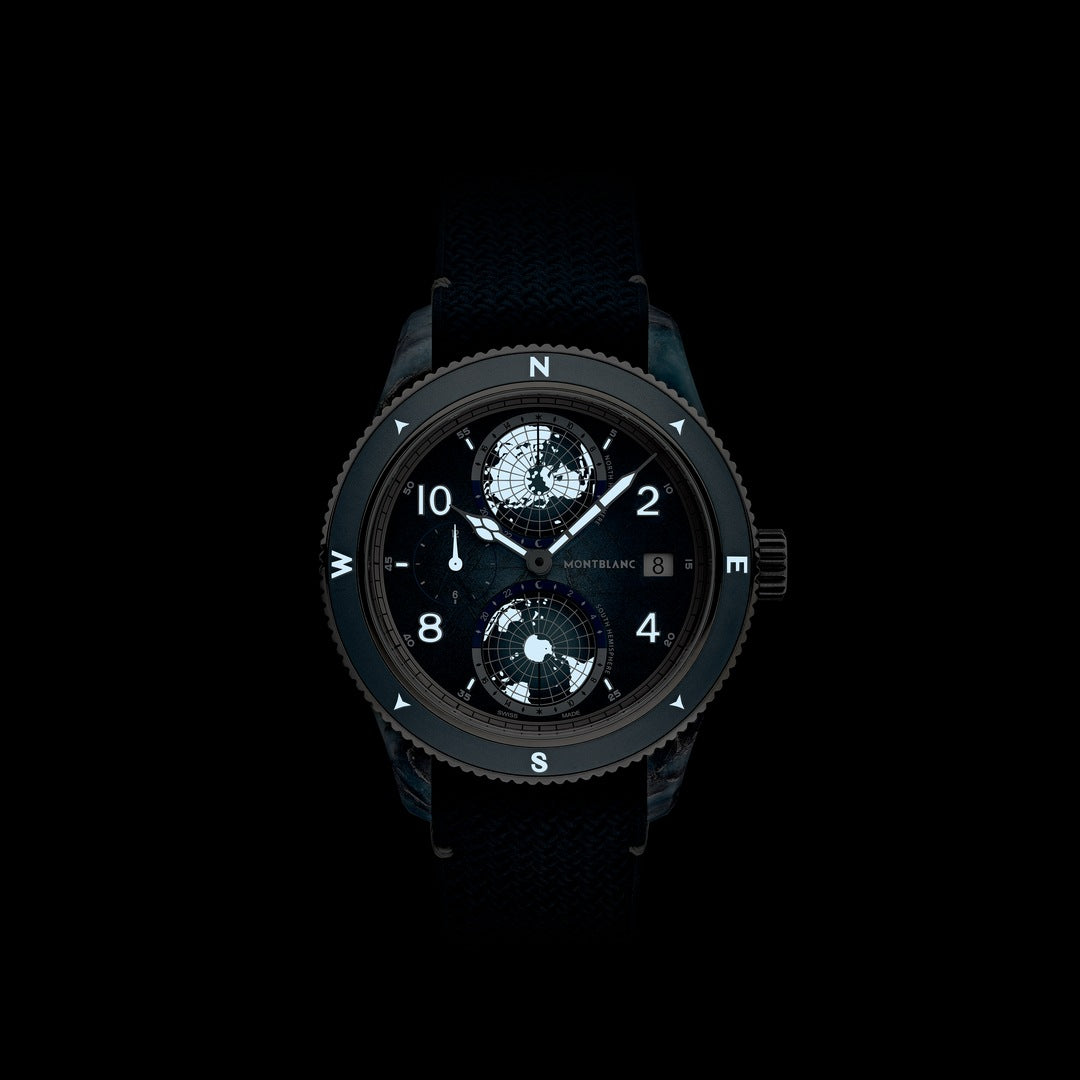 Black wristwatch with detailed face on a black background