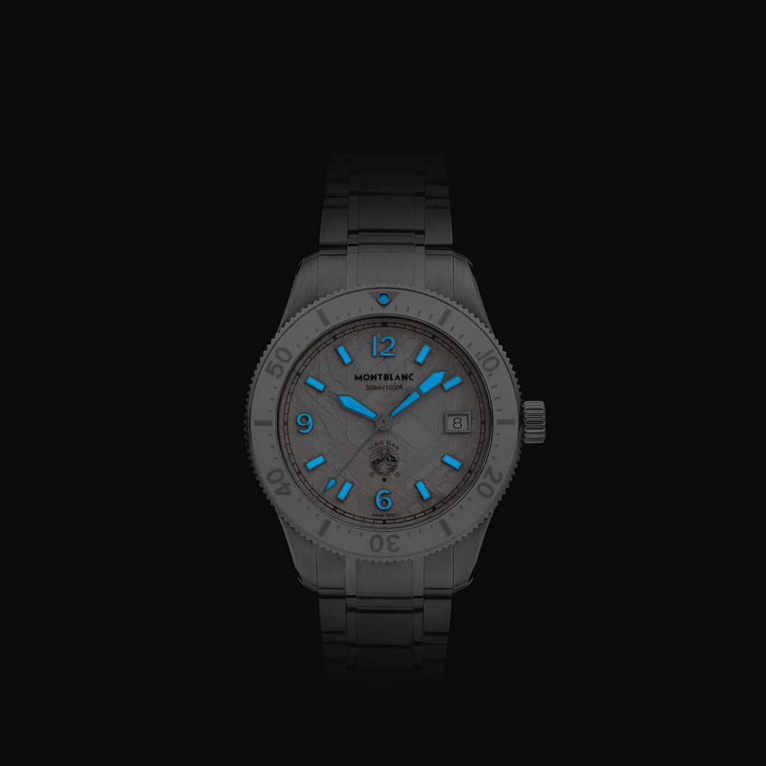 Gray watch with blue accents on a black background