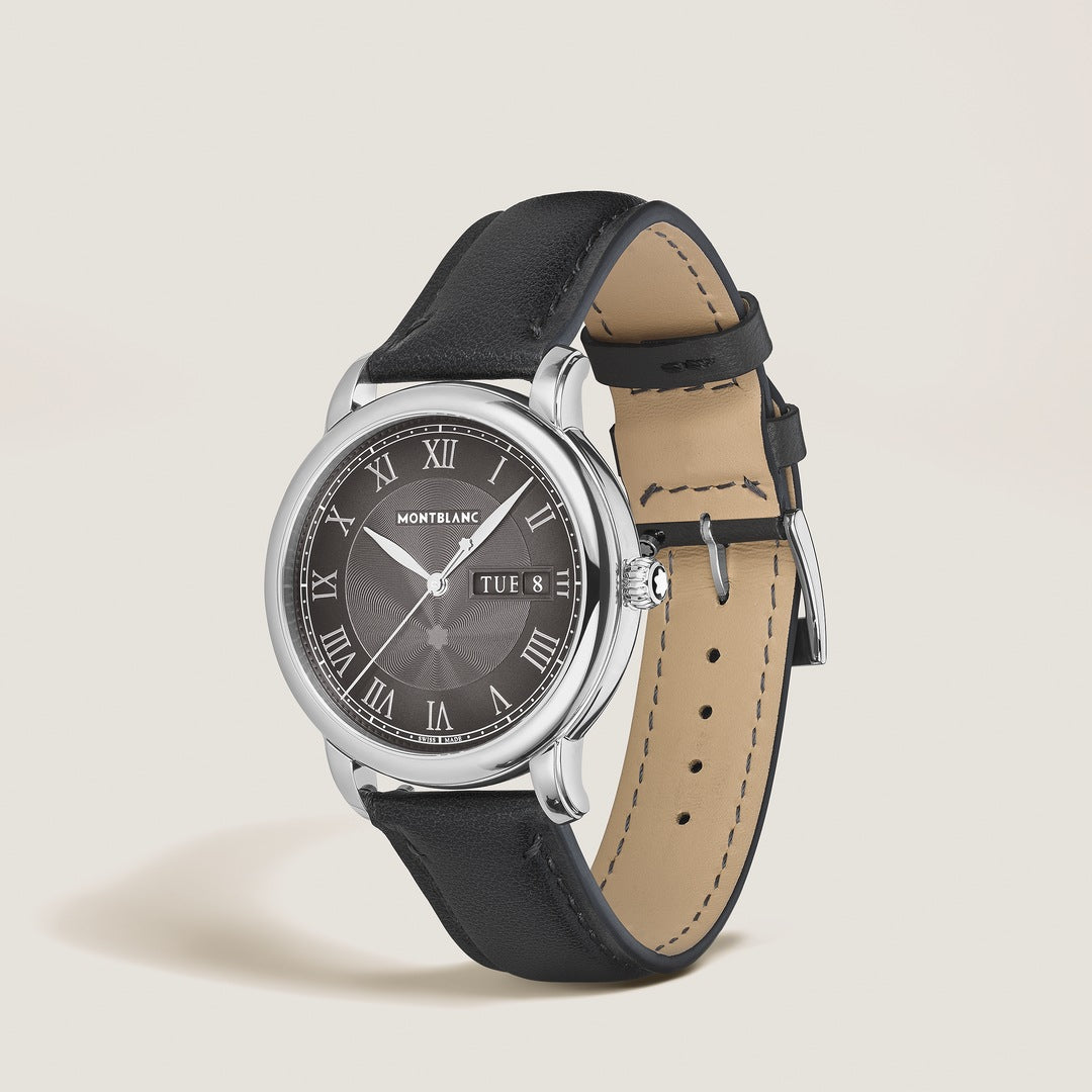 Montblanc watch with black leather strap on a light beige background