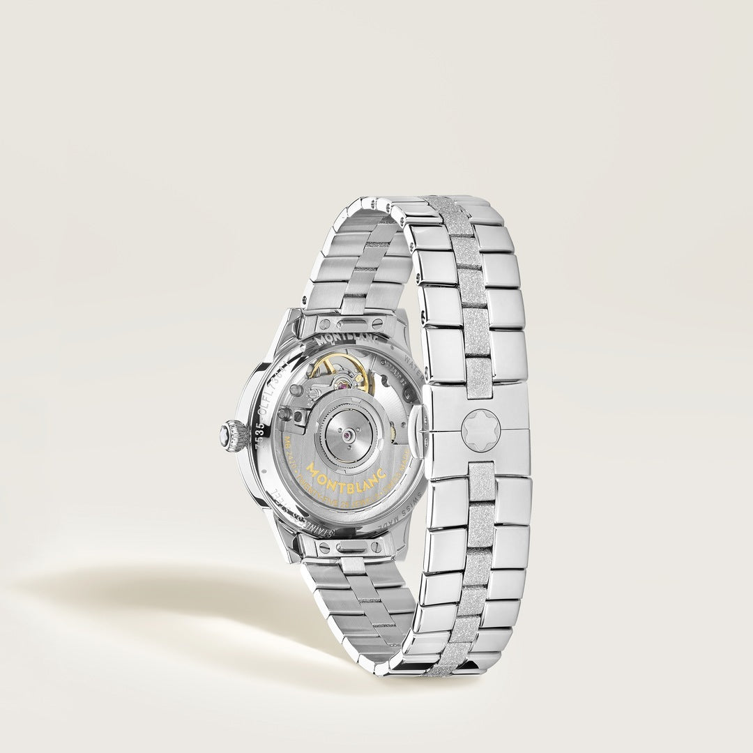 Silver watch with a detailed mechanism on a light gray background