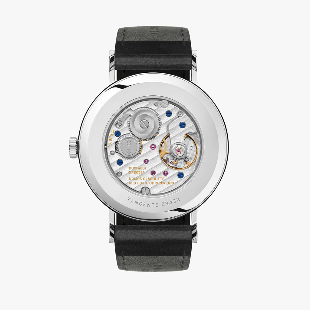 NOMOS Glashütte Tangente 38mm watch with white dial, stainless steel case, and black leather strap on white background, exhibition case-back view