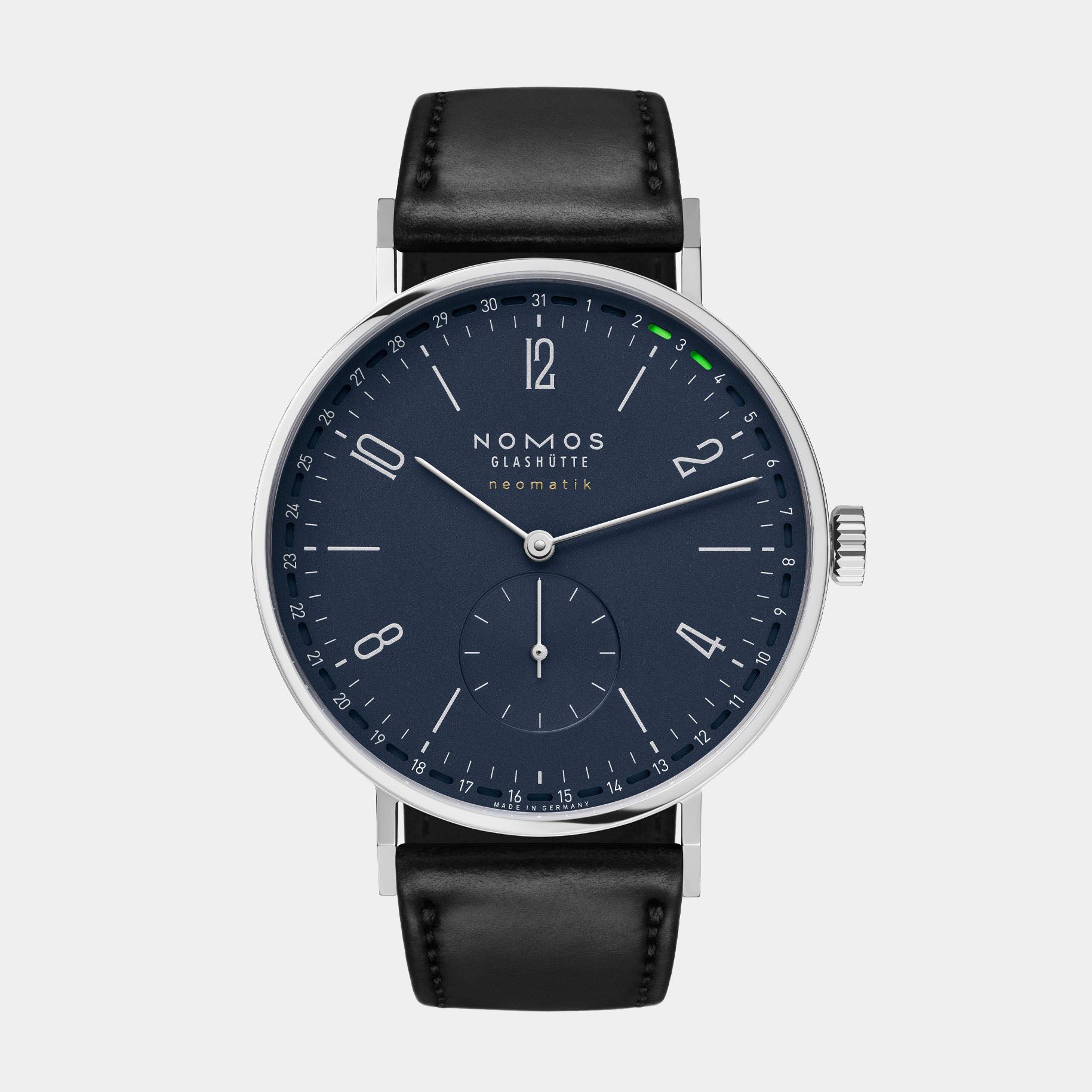 NOMOS Glashütte Tangente Neomatik 41mm watch with midnight blue dial, stainless steel case, and black leather strap on grey background, front angle view.