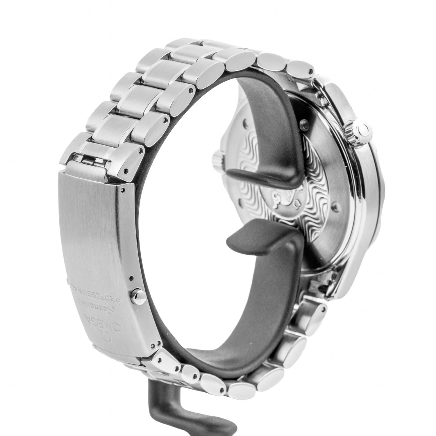 Close-up of a silver stainless steel watch band with a textured patterned dial visible on the inside, shown on a white background.