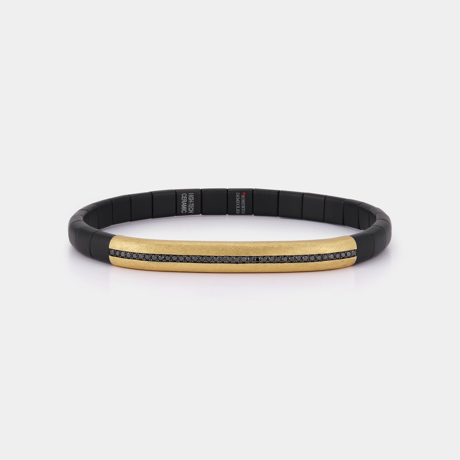 Roberto Demeglio matte black ceramic and 18K yellow gold bracelet with a row of round black diamonds on a white background, front angle view.