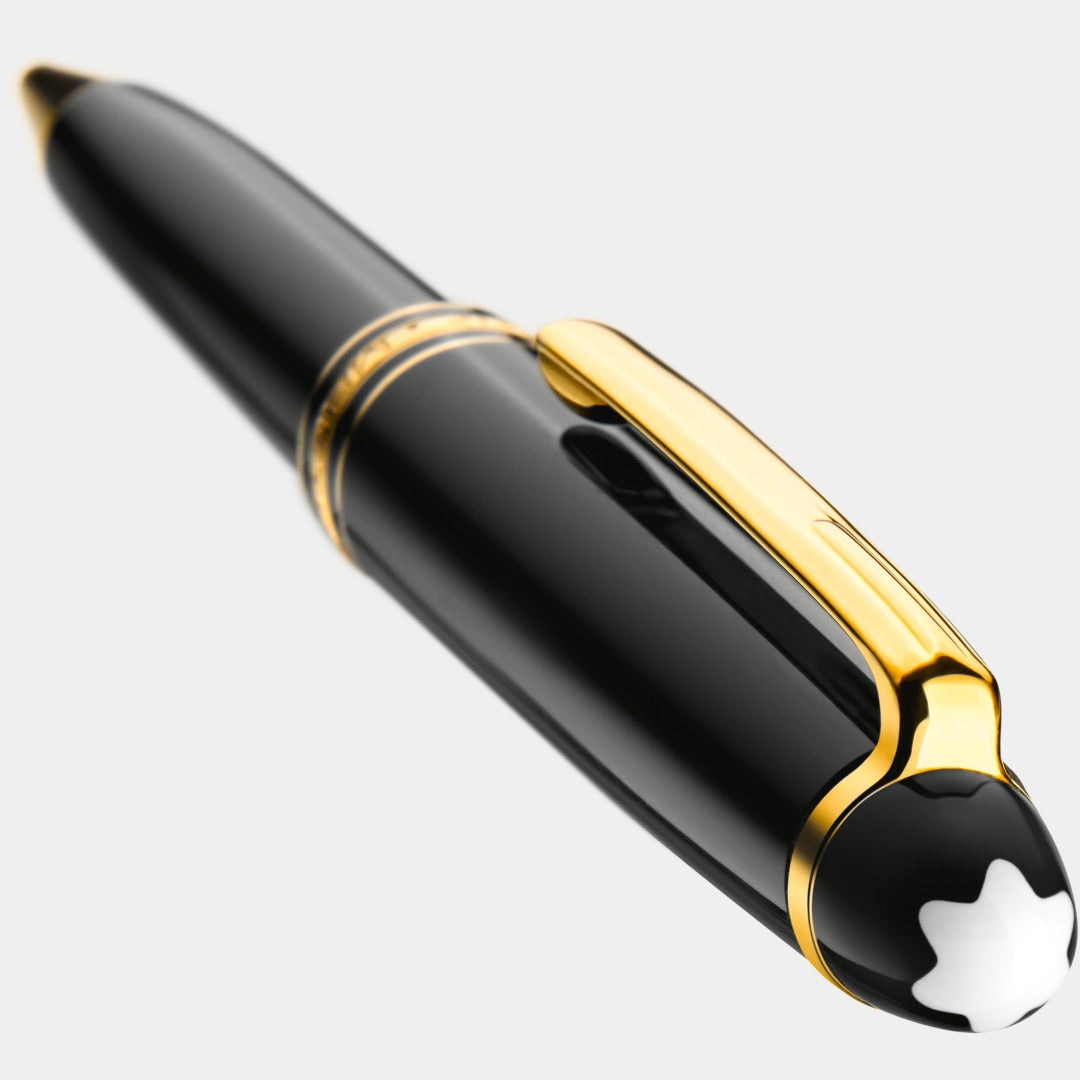 Black and gold pen with a white montblanc logo on a light gray background