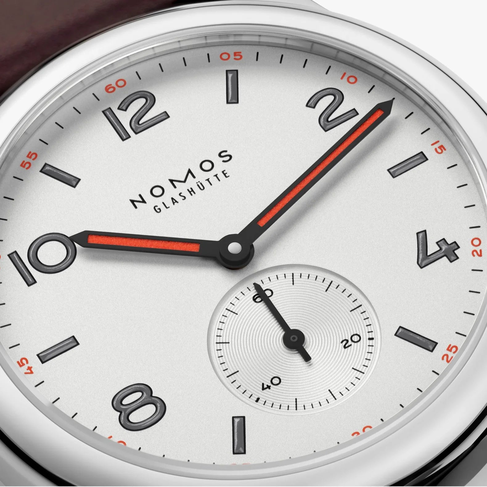 NOMOS Glashütte Club 36mm watch with white silver-plated dial, black and red hands, dial closeup