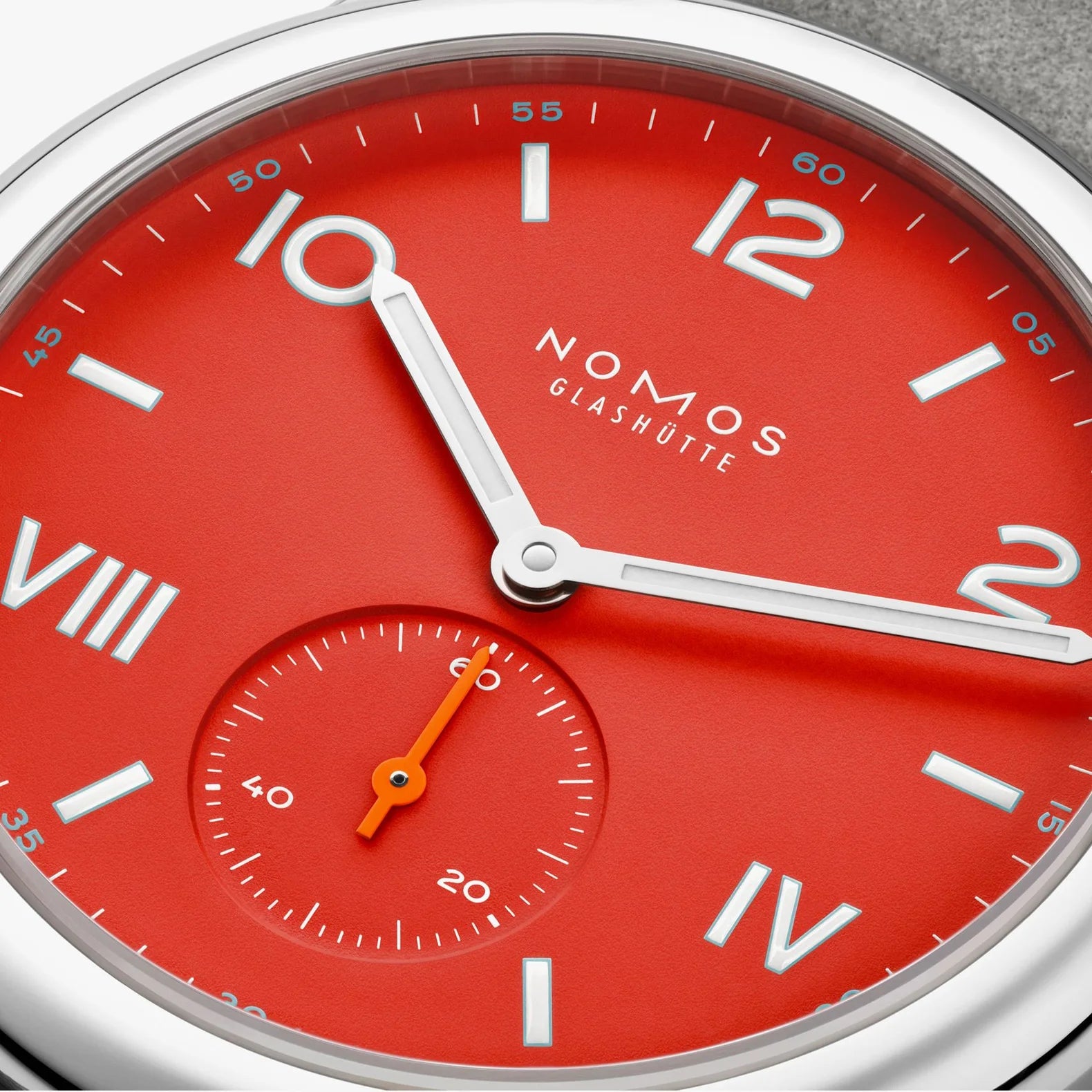 NOMOS Glashütte Club Campus 36mm watch with bold red dial, white luminous hands, dial closeup