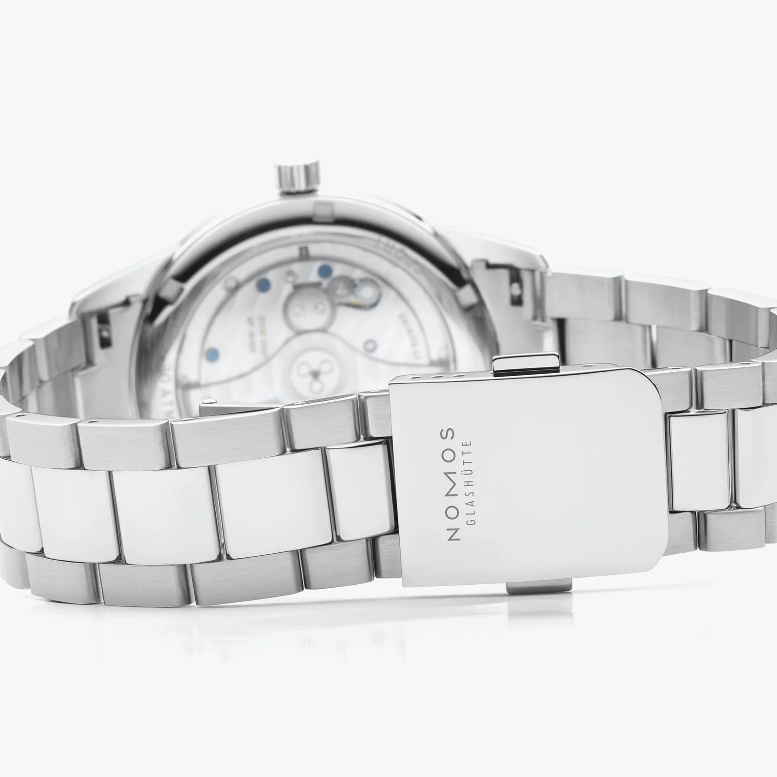 NOMOS Glashütte Club Sport Neomatik 39mm watch with tabac brown sunburst dial, luminous hands, and stainless steel bracelet on white background, clasp view.