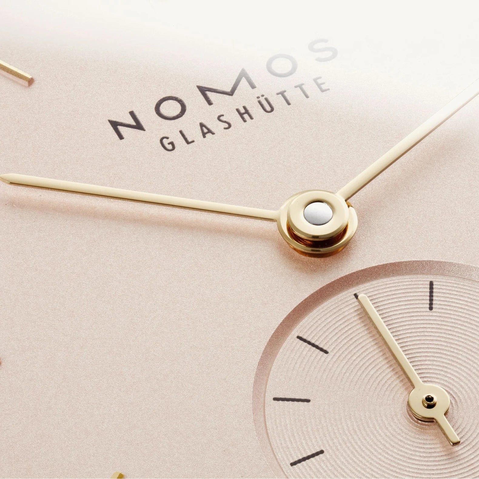 NOMOS Glashütte Orion 33mm watch with blush pink dial, sub dial closeup
