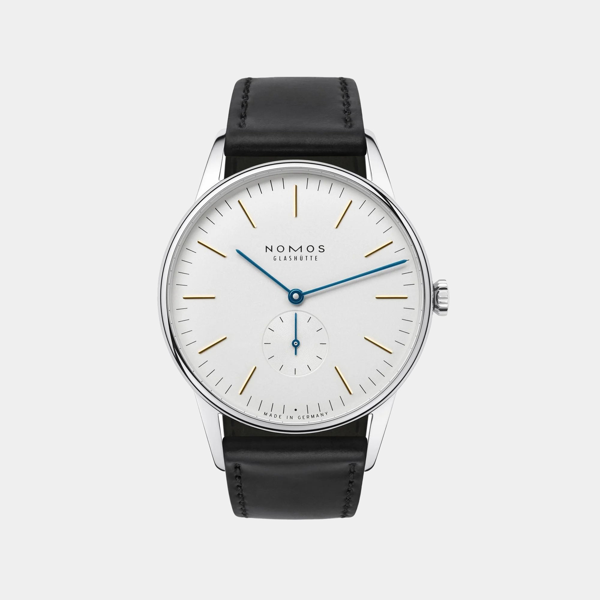 NOMOS Glashütte Orion 38mm watch with white silver-plated dial, tempered blue hands, and black Horween leather strap on grey background, front angle view.