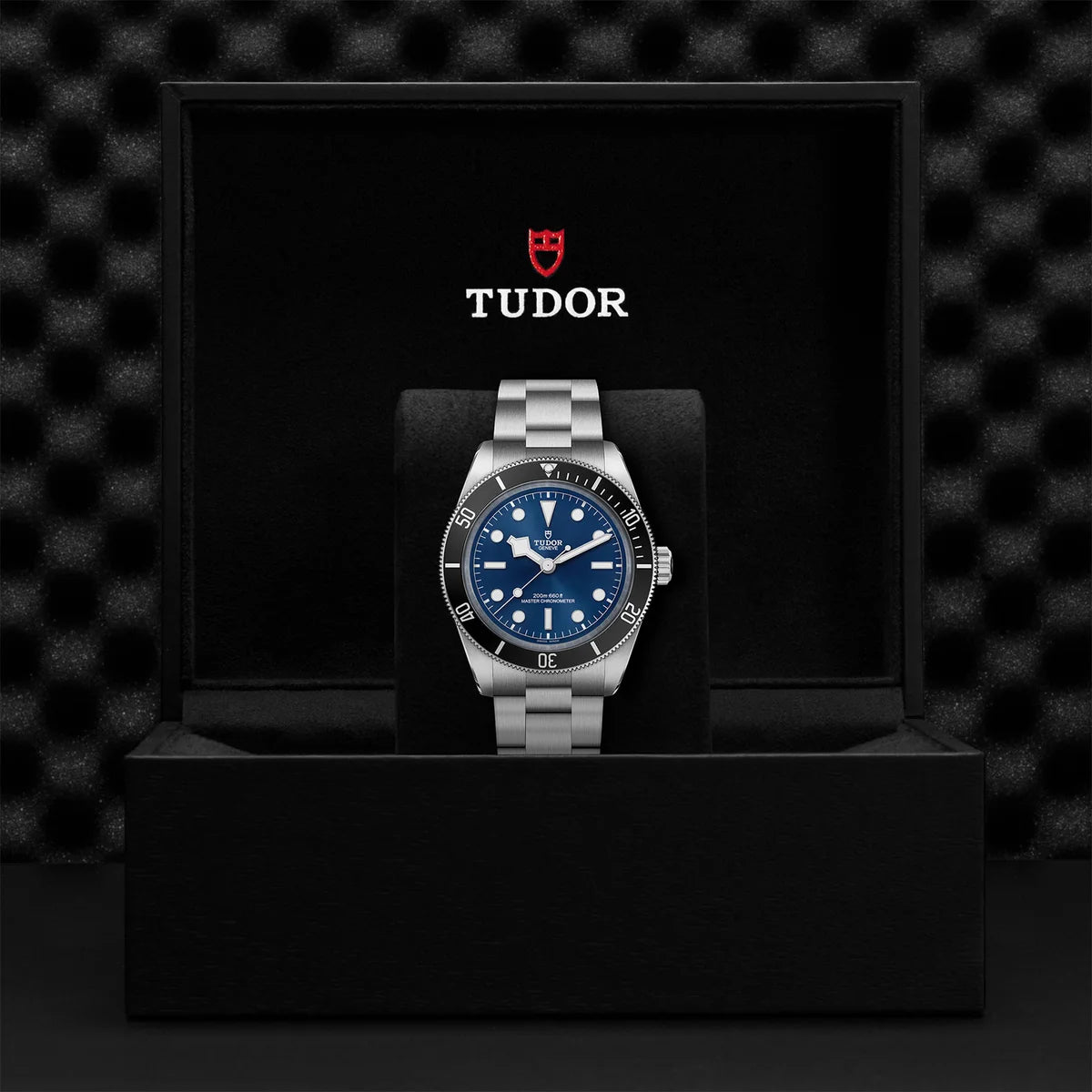 TUDOR black bay 68 43mm blue dial watch on 3-link bracelet, presented inside the official Tudor presentation box.