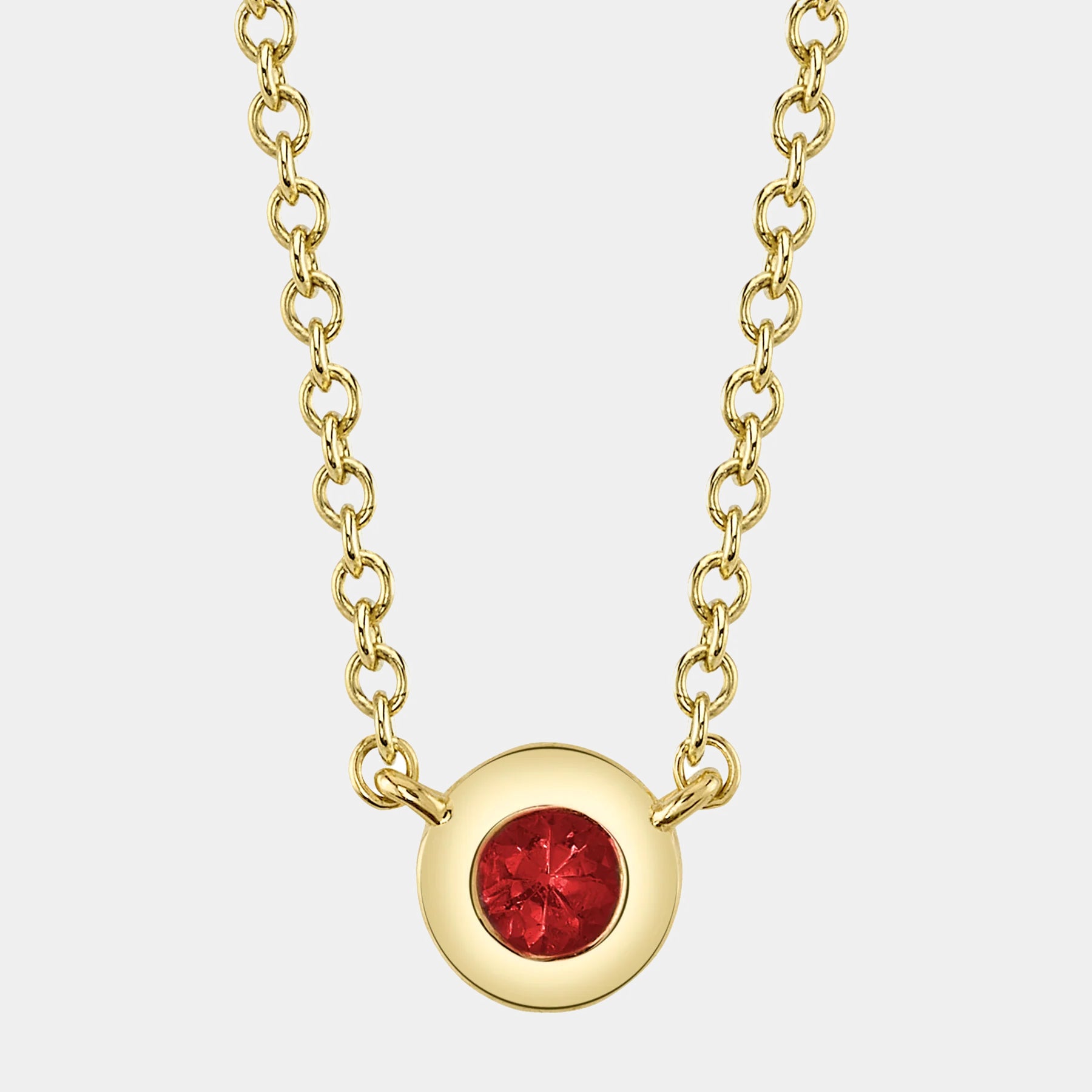 14K yellow gold bezel pendant necklace with a round 0.05 ct. ruby by Shy Creation