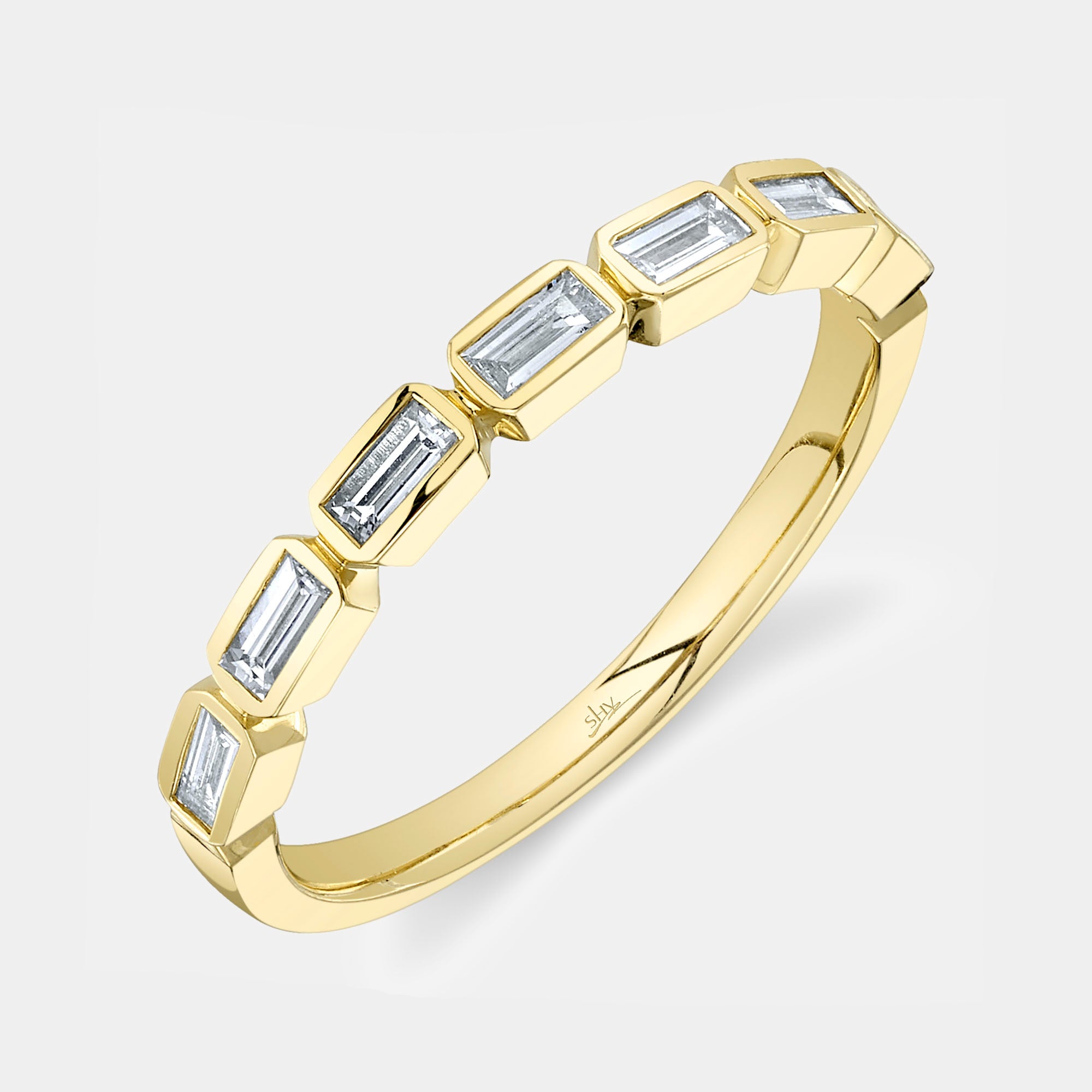 Yellow gold bezel set baguette diamond fashion ring, top angle view