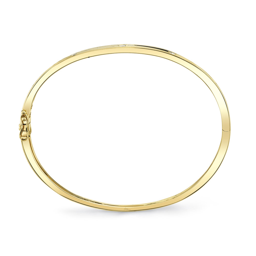 Yellow gold bezel set diamond bangle bracelet, side upright view