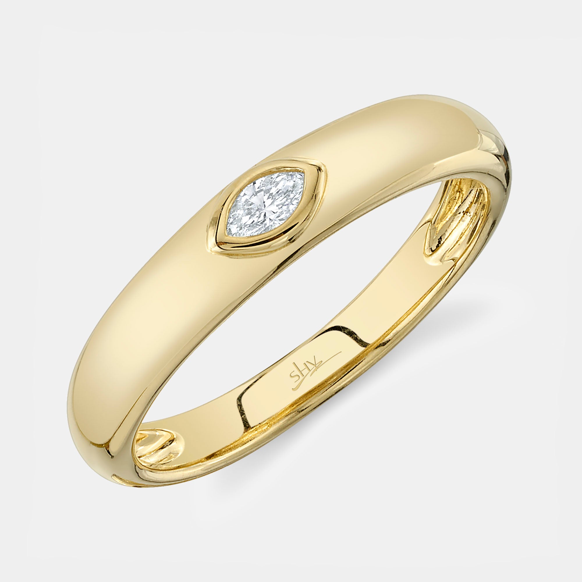 Yellow gold bezel set marquise diamond fashion ring, side angle view