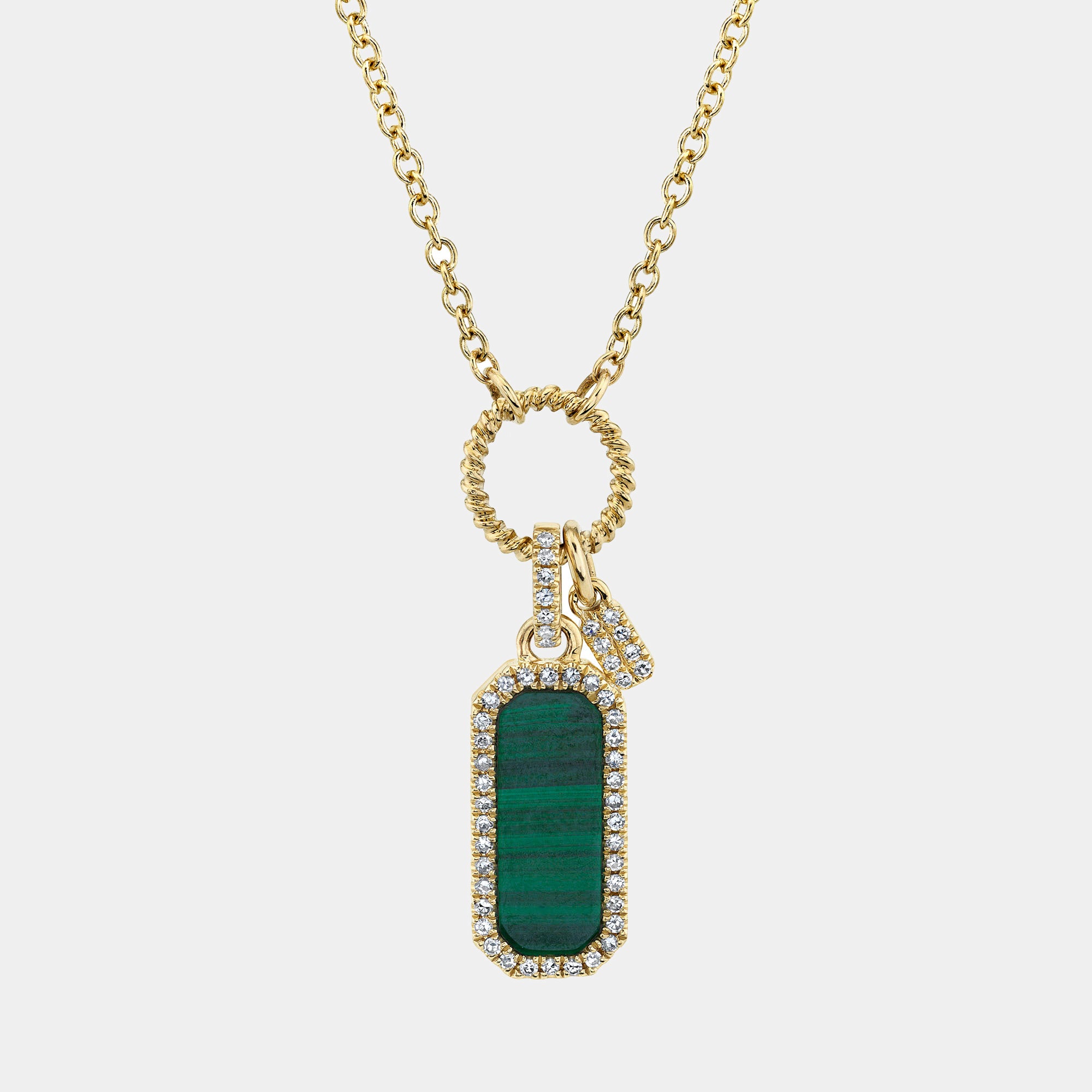 Yellow gold dog tag necklace featuring green malachite inlay, front view