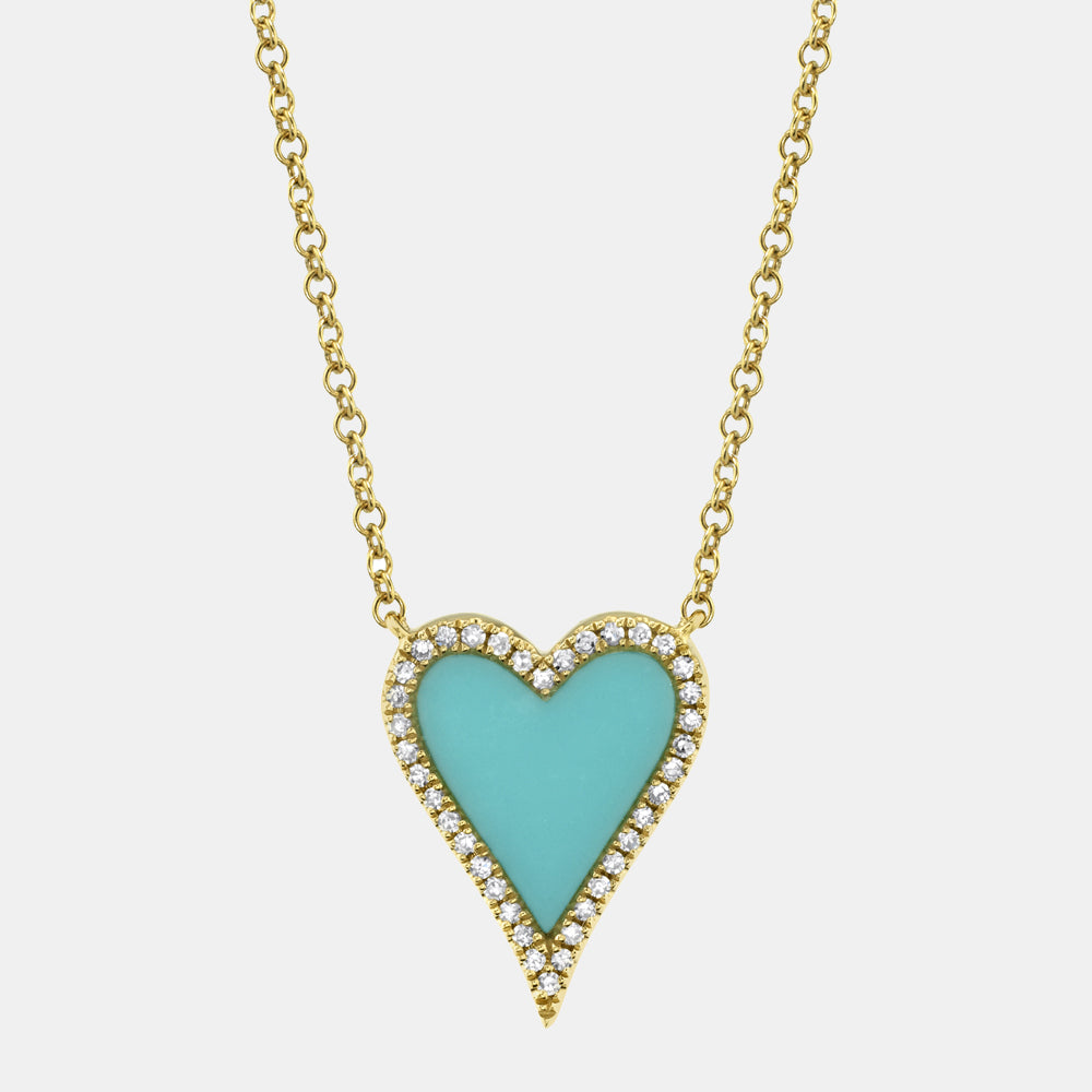Turquoise heart-shaped diamond pendant on a gold chain against a white background