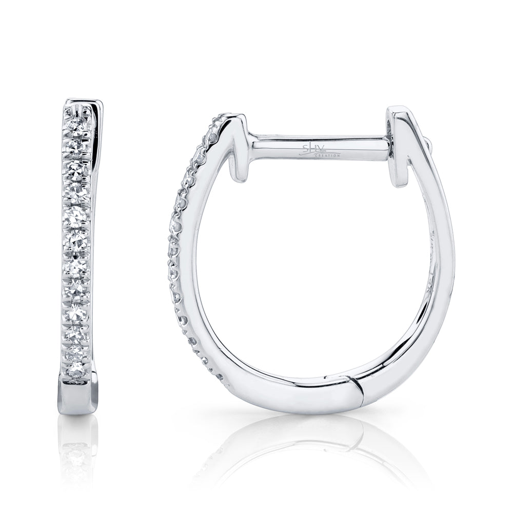White gold diamond huggie earrings, side angle view