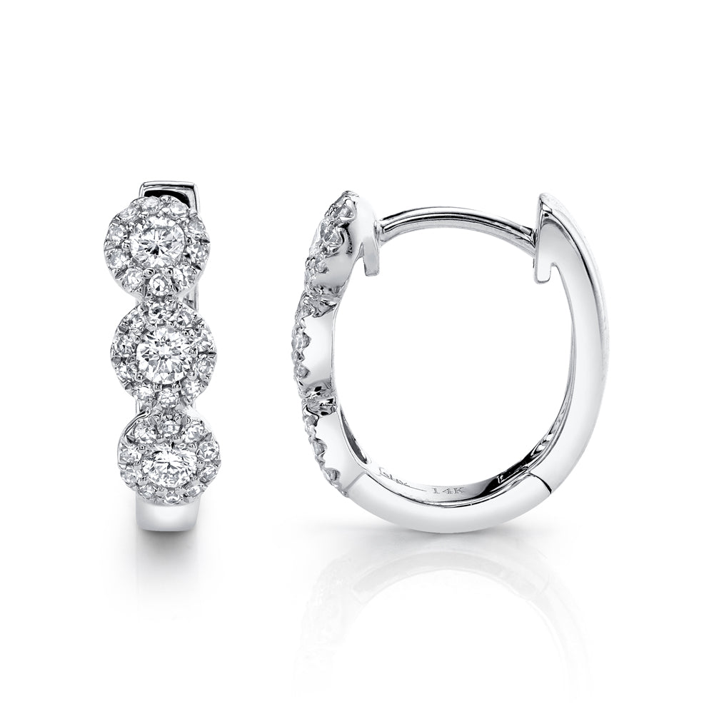 White gold diamond huggie earrings, side angle view