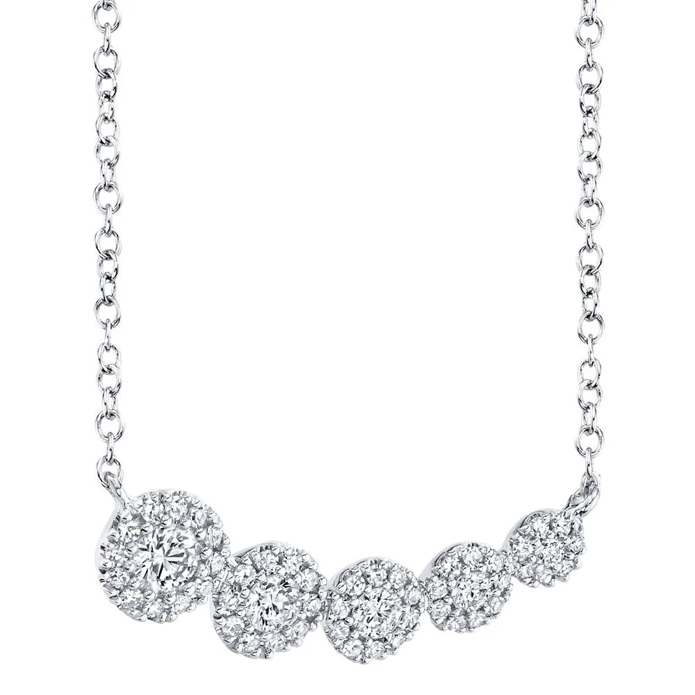 White gold diamond necklace with five diamond solitaire pendants, front angle view