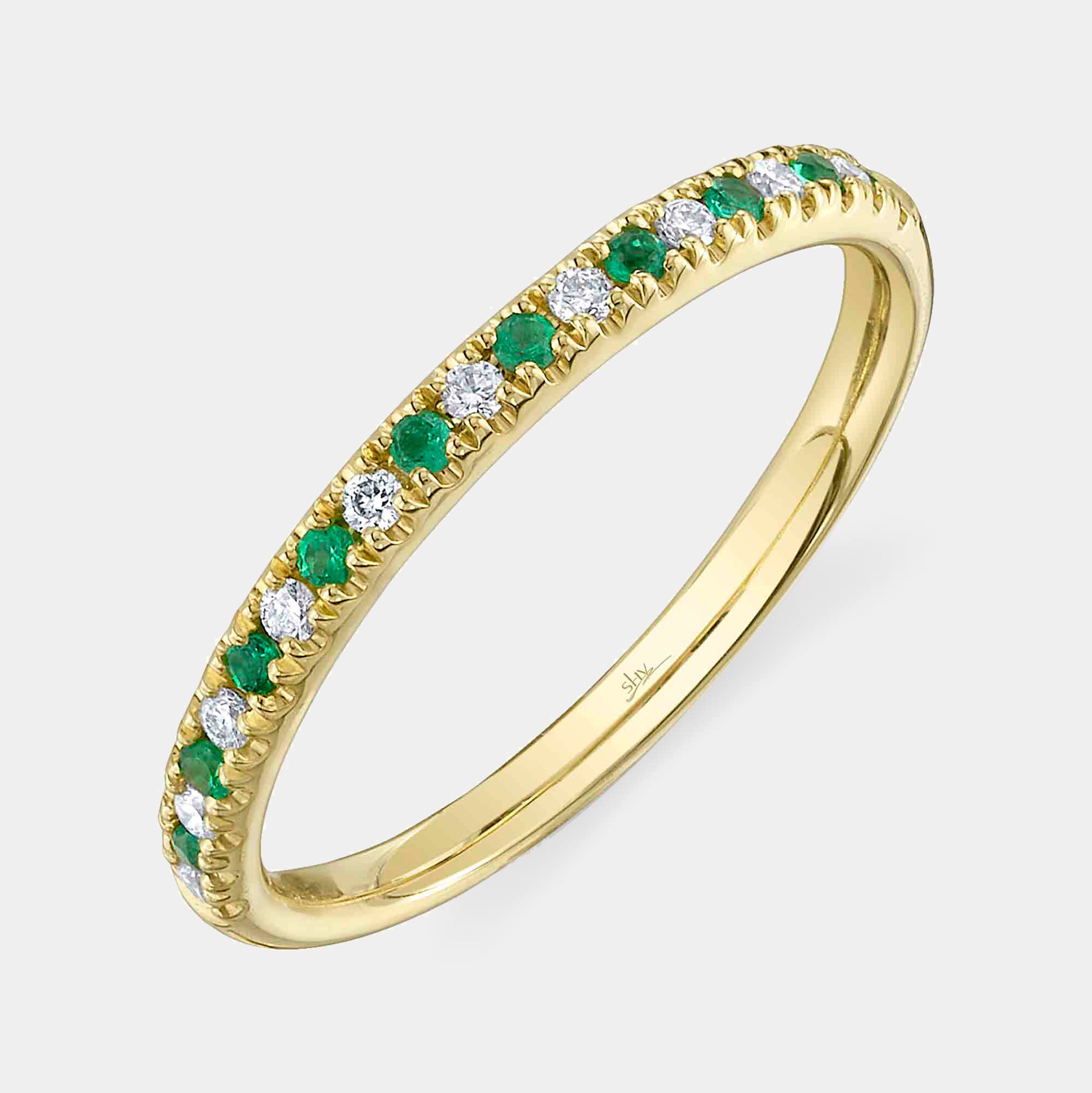 Yellow gold emerald and diamond stacking ring, front angle view