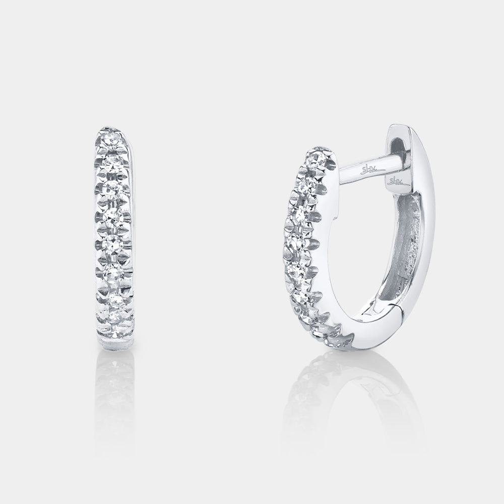 White gold diamond huggie earrings, front view
