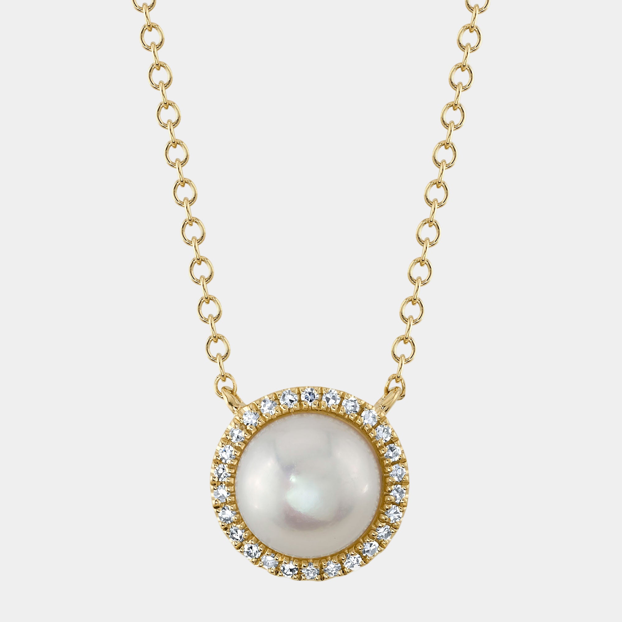 Pearl necklace with gold chain and diamond accents