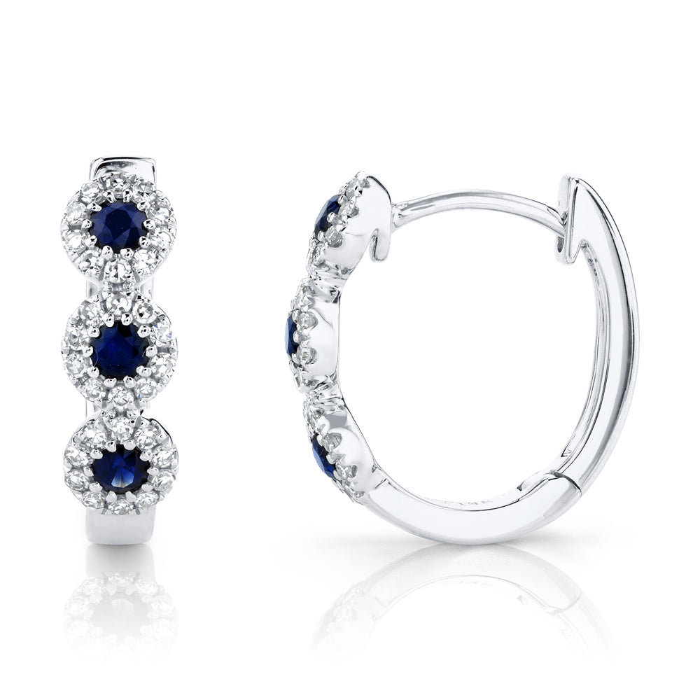 White gold sapphire and diamond huggie earrings, side angle view