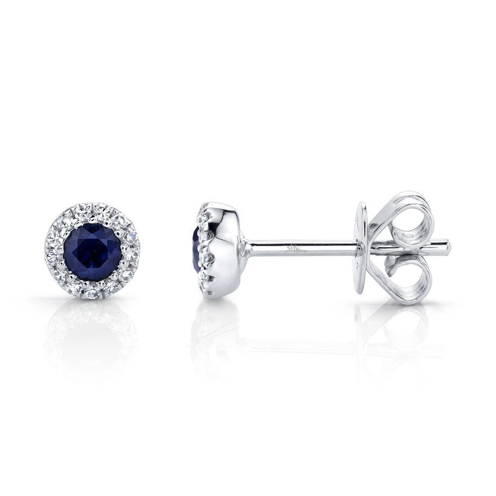 White gold sapphire diamond stud earrings with diamond halo, side angle view