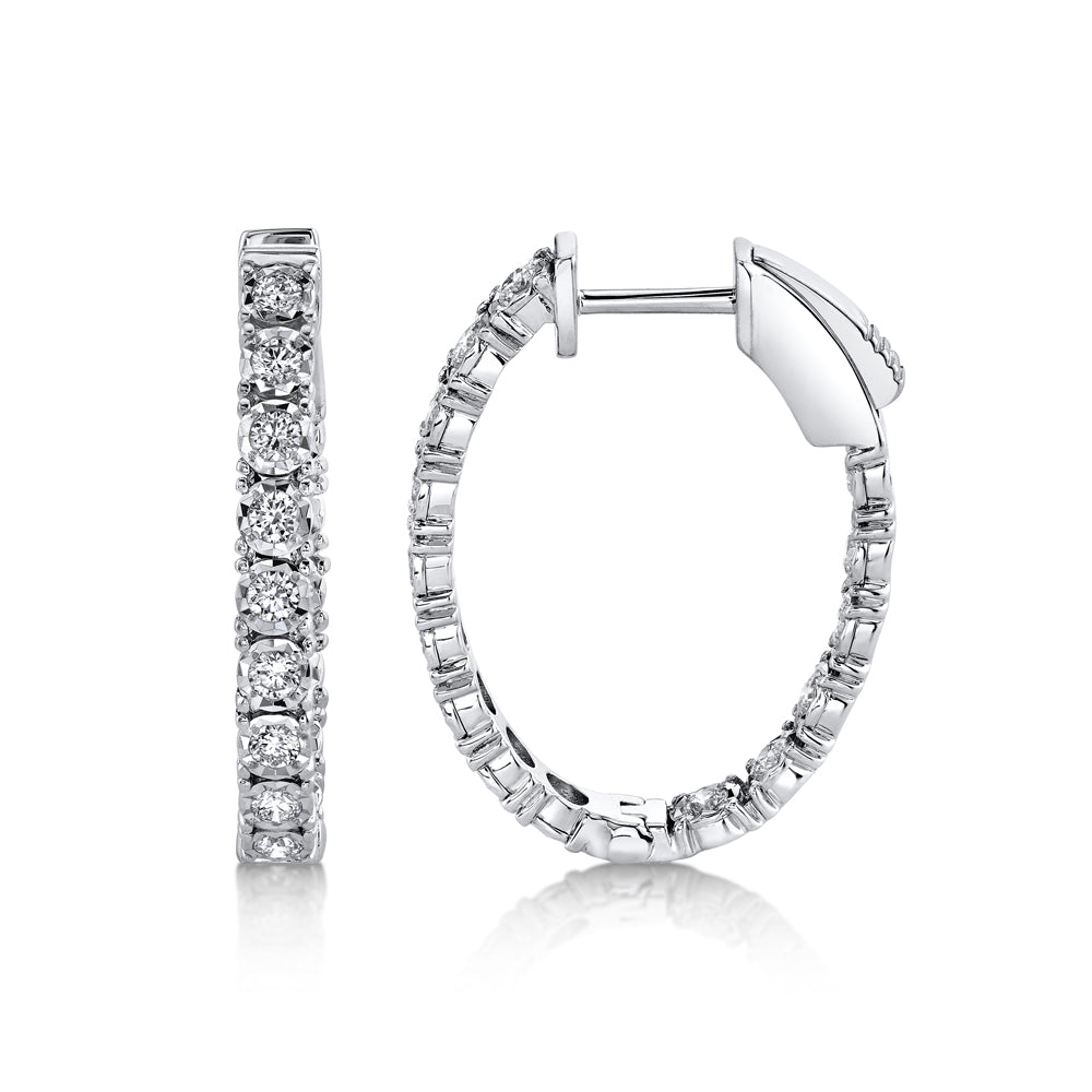 White gold diamond hoop earrings, side angle view