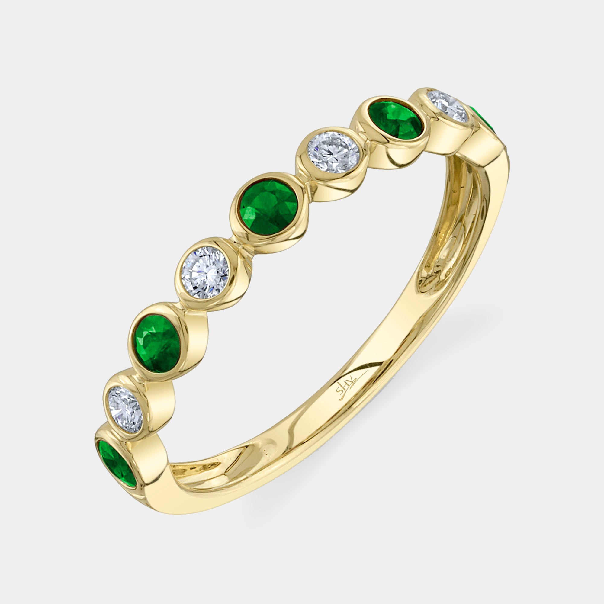 Yellow gold emerald and diamond fashion ring, front angle view
