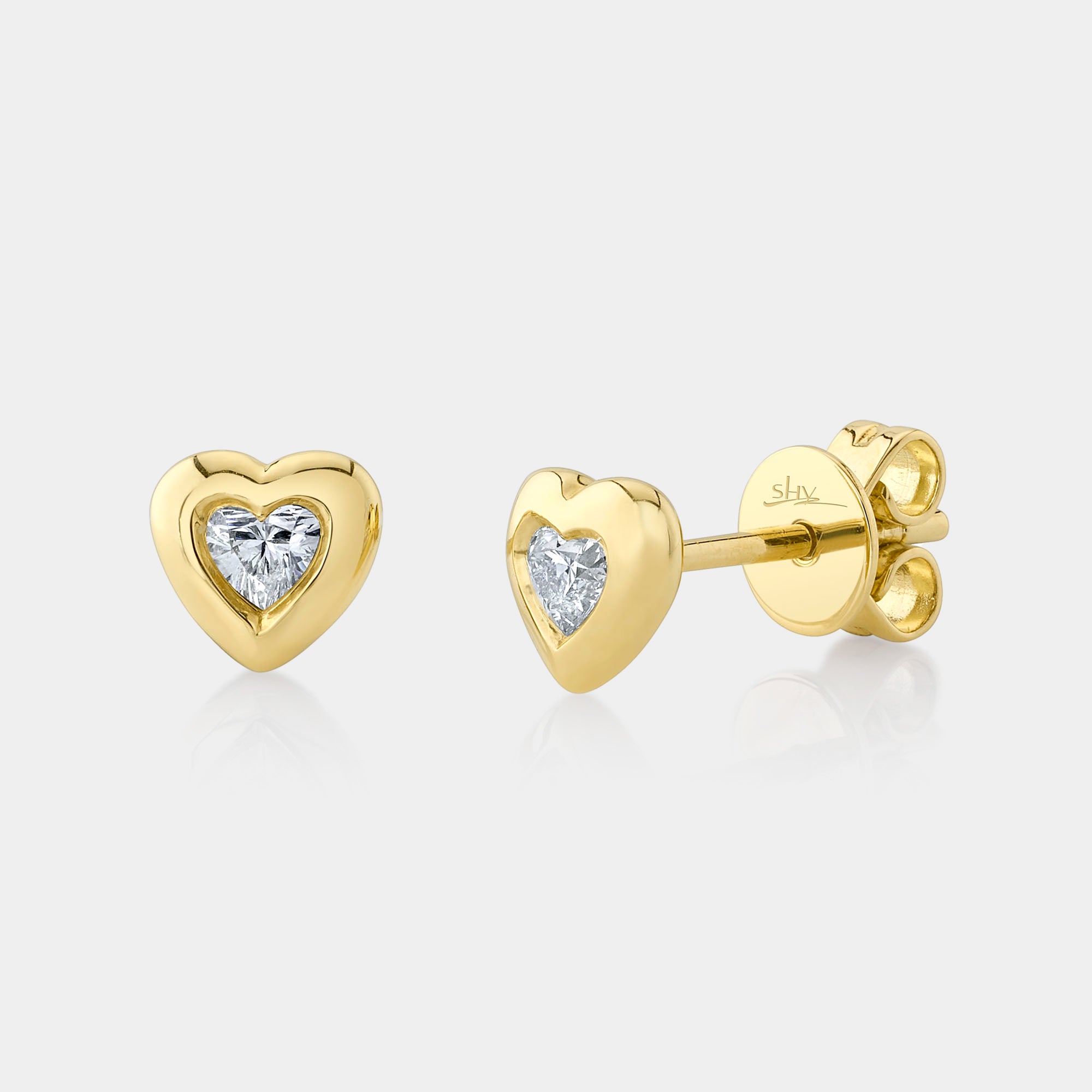 Yellow gold bezel set heart shaped diamond stud earrings, front angle view
