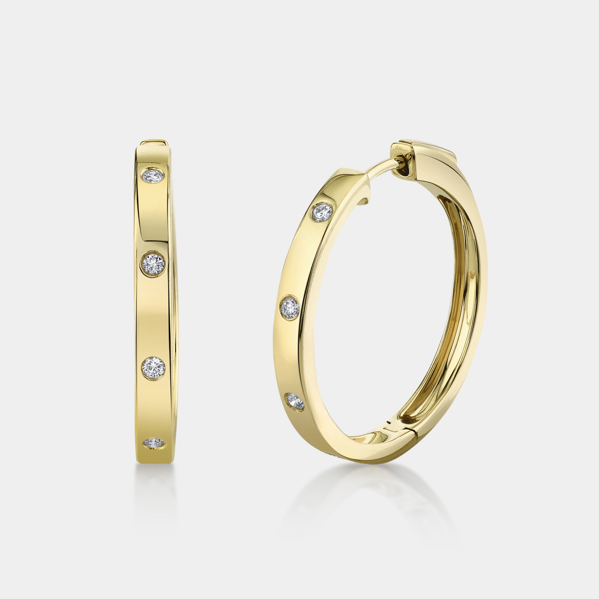 Yellow gold bezel set diamond hoop earrings, front angle view