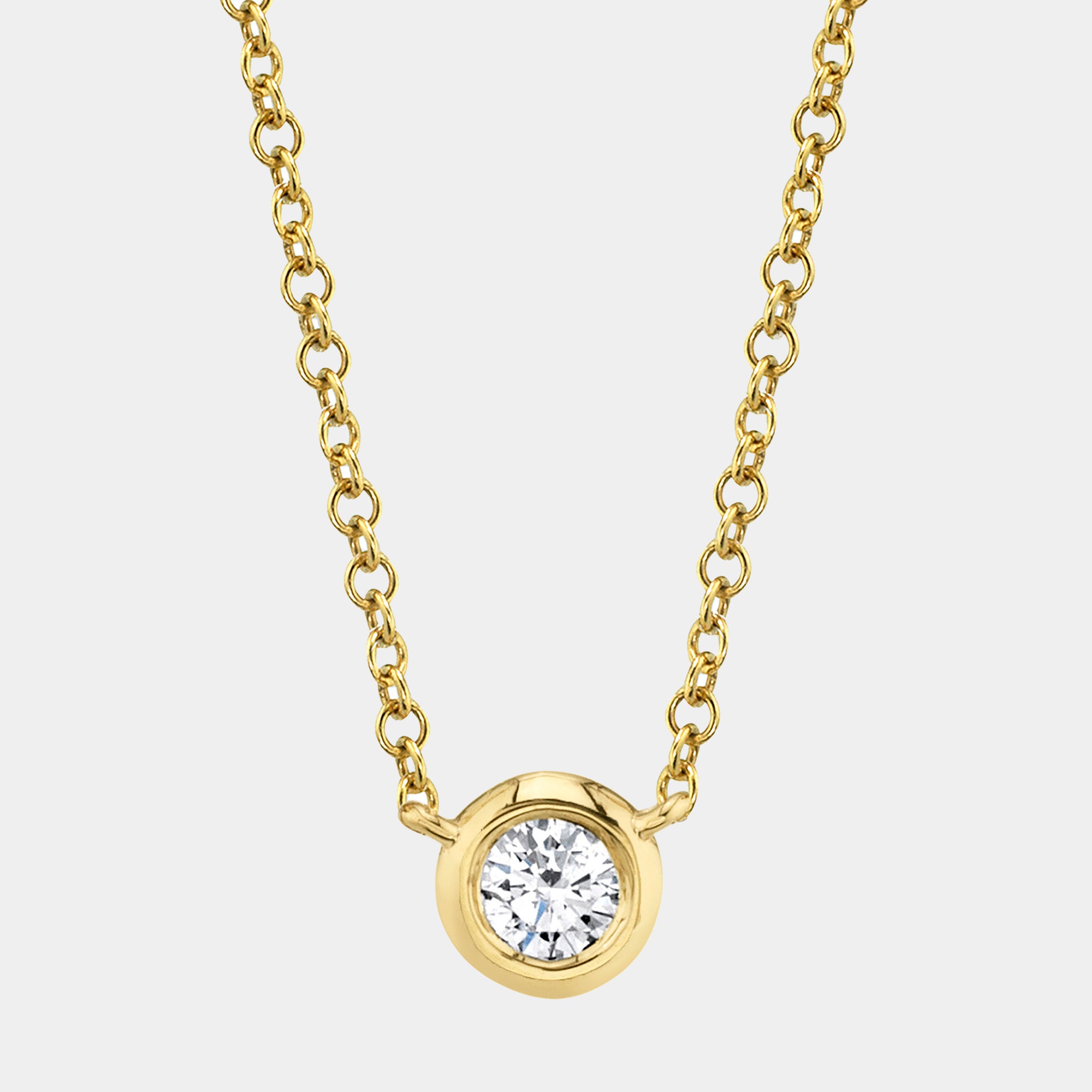 Yellow gold bezel-set diamond pendant necklace, front angle view