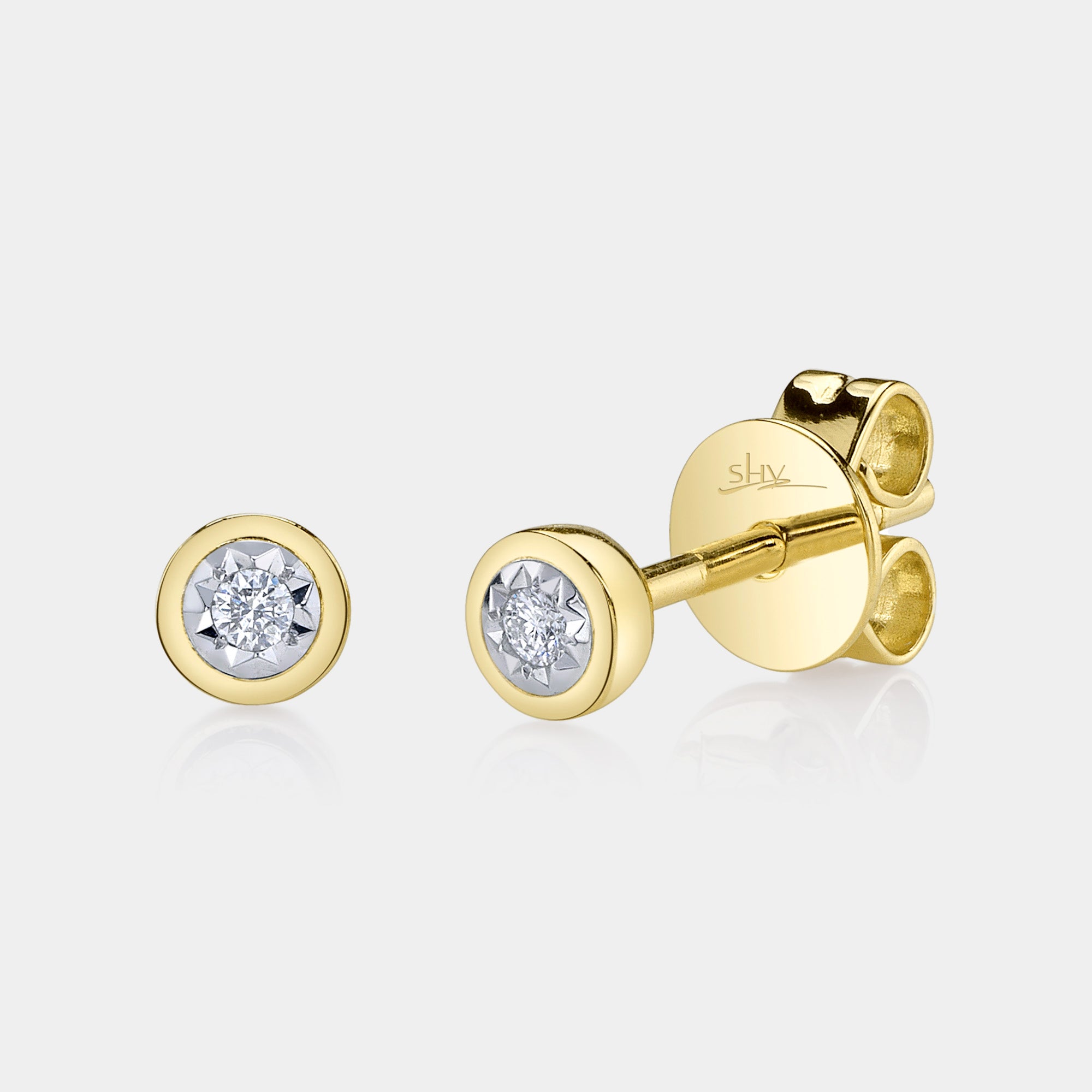 Yellow gold bezel set diamond stud earrings, front angle view