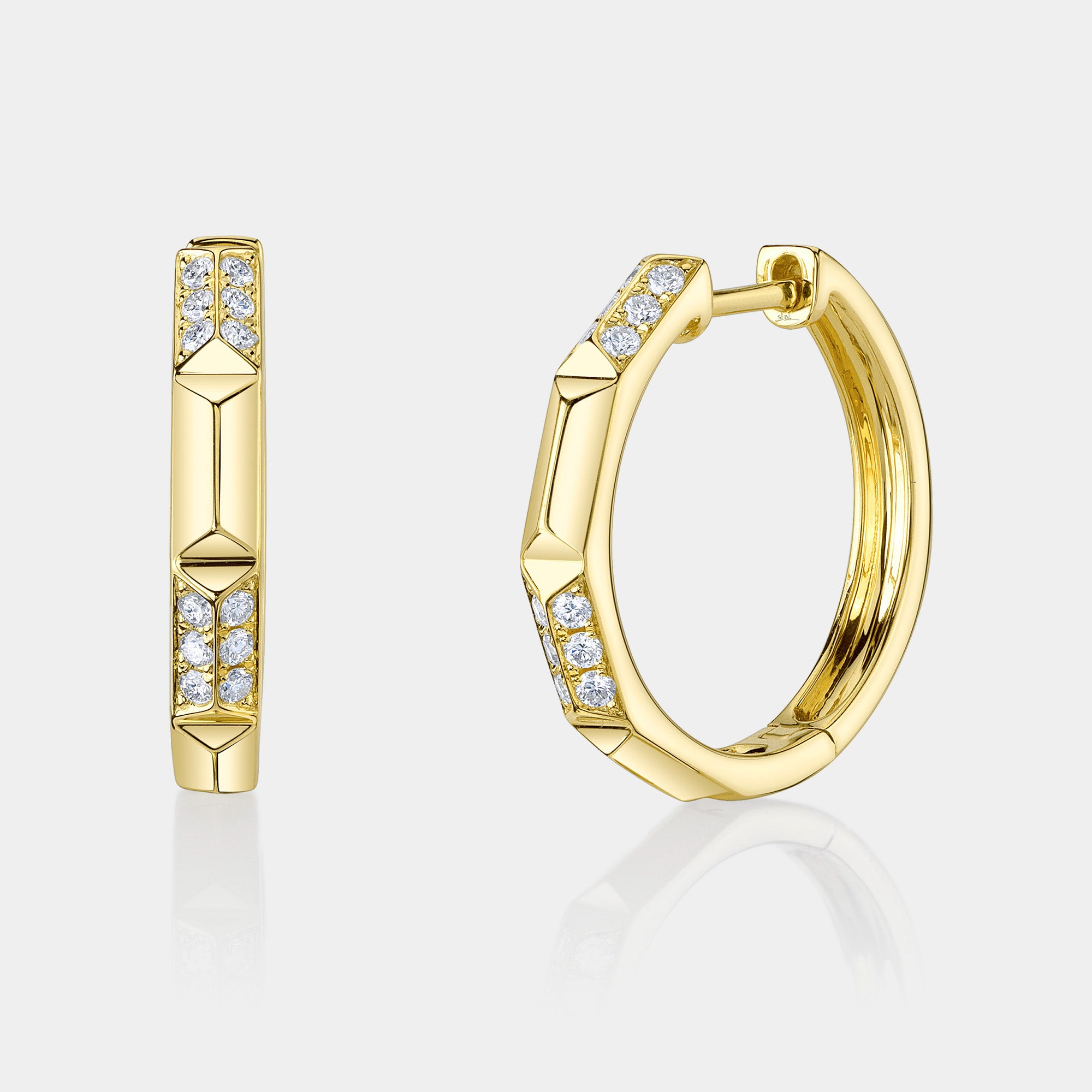 Yellow gold geo cut diamond huggie earrings, front angle view