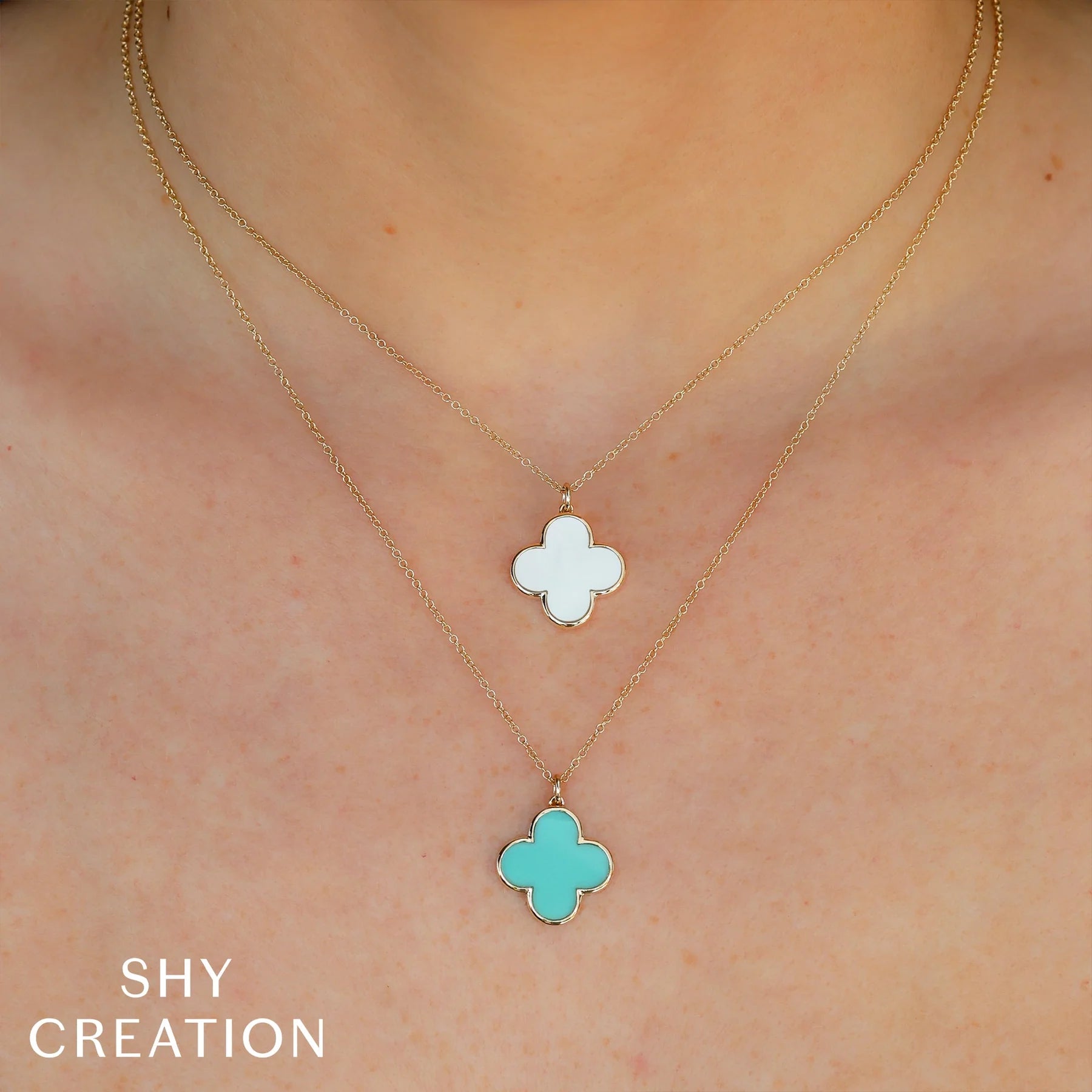 Woman wearing yellow gold mother of pearl pendant necklace